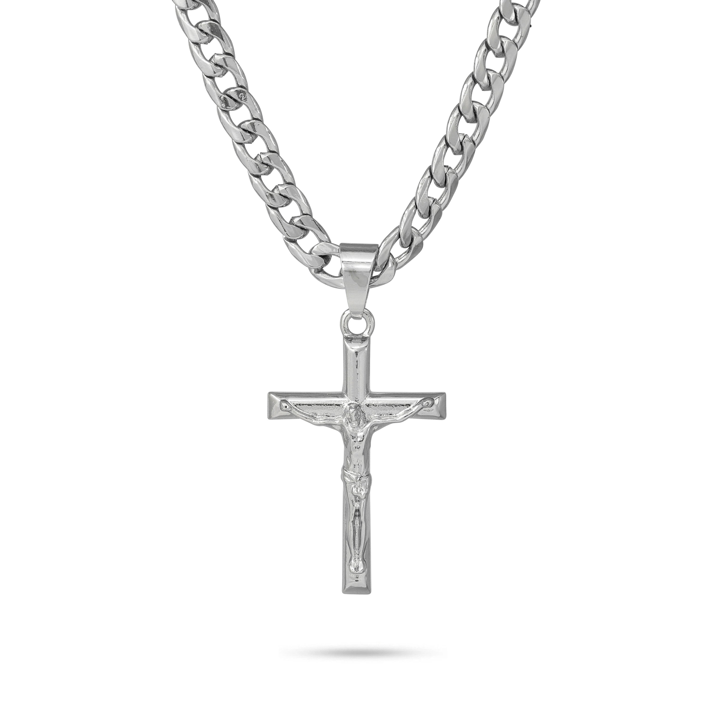 Silver men's crucifix pendant with engraved Christ design on thick Cuban link necklace.