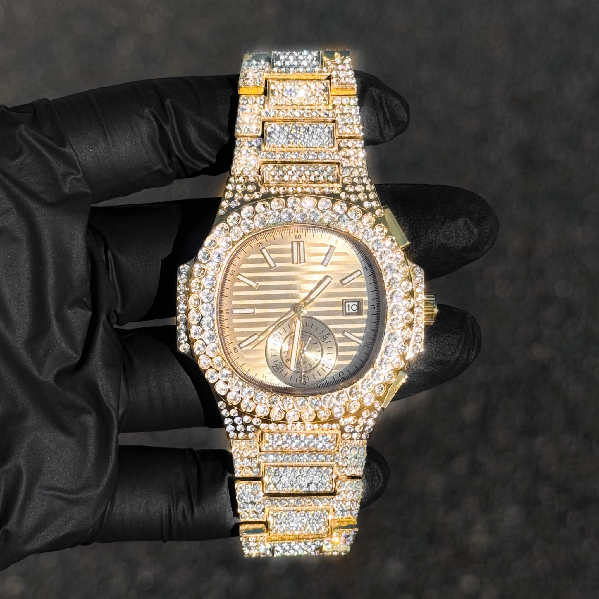 Men's 43mm gold luxury iced out watch with quartz movement and fully diamond-set bracelet.