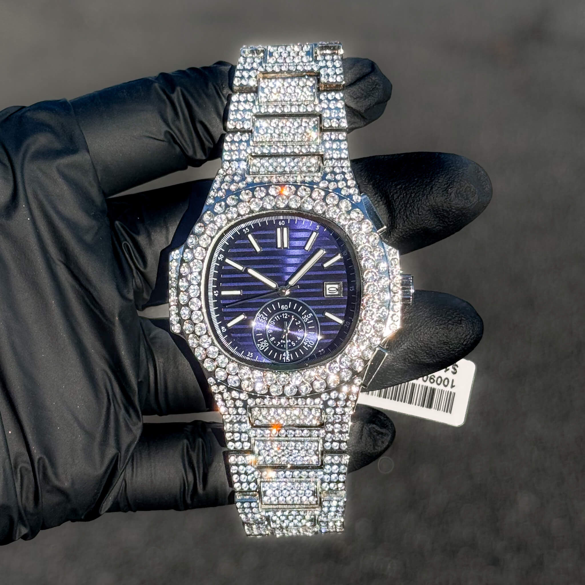 Men's 43mm diamond-encrusted oblong watch featuring a deep blue dial and full iced-out band.