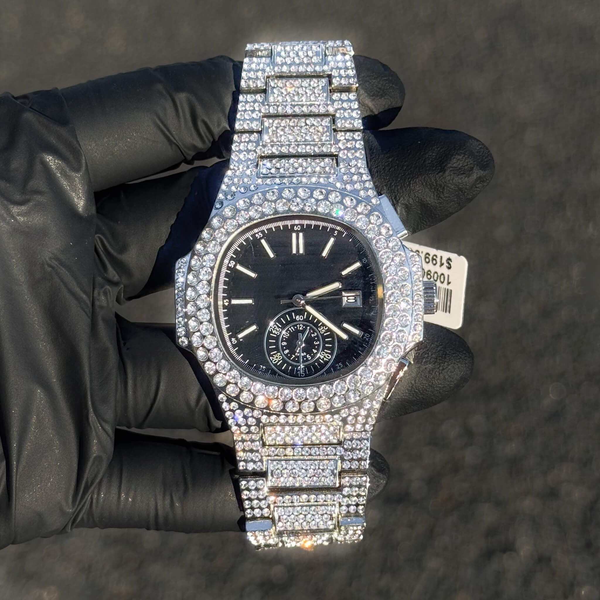 Men's 43mm iced out oblong watch with black dial, quartz movement, and fully diamond-covered band.