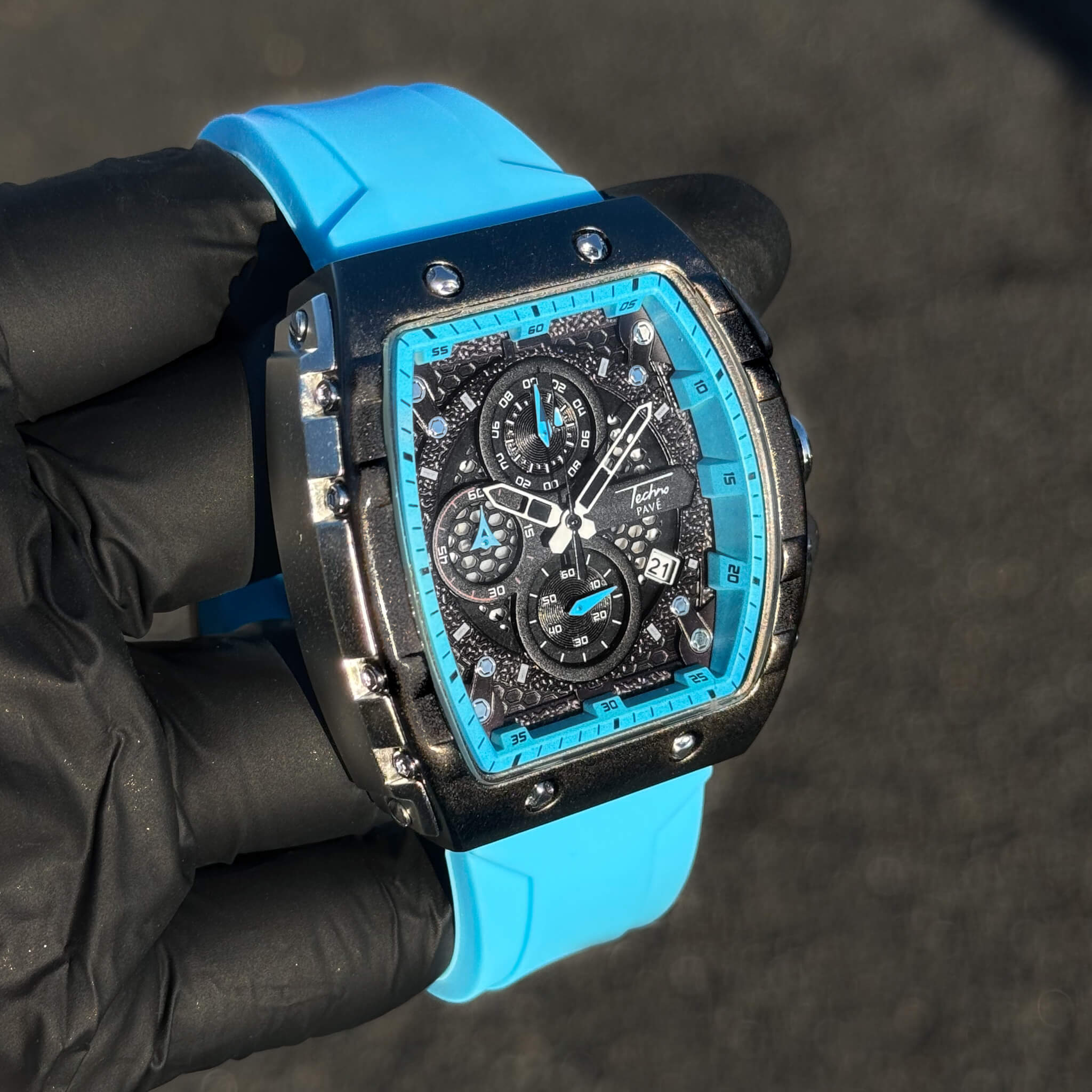 Men's 46mm vibrant tonneau sport watch featuring blue silicone band and bold multi-dial face.