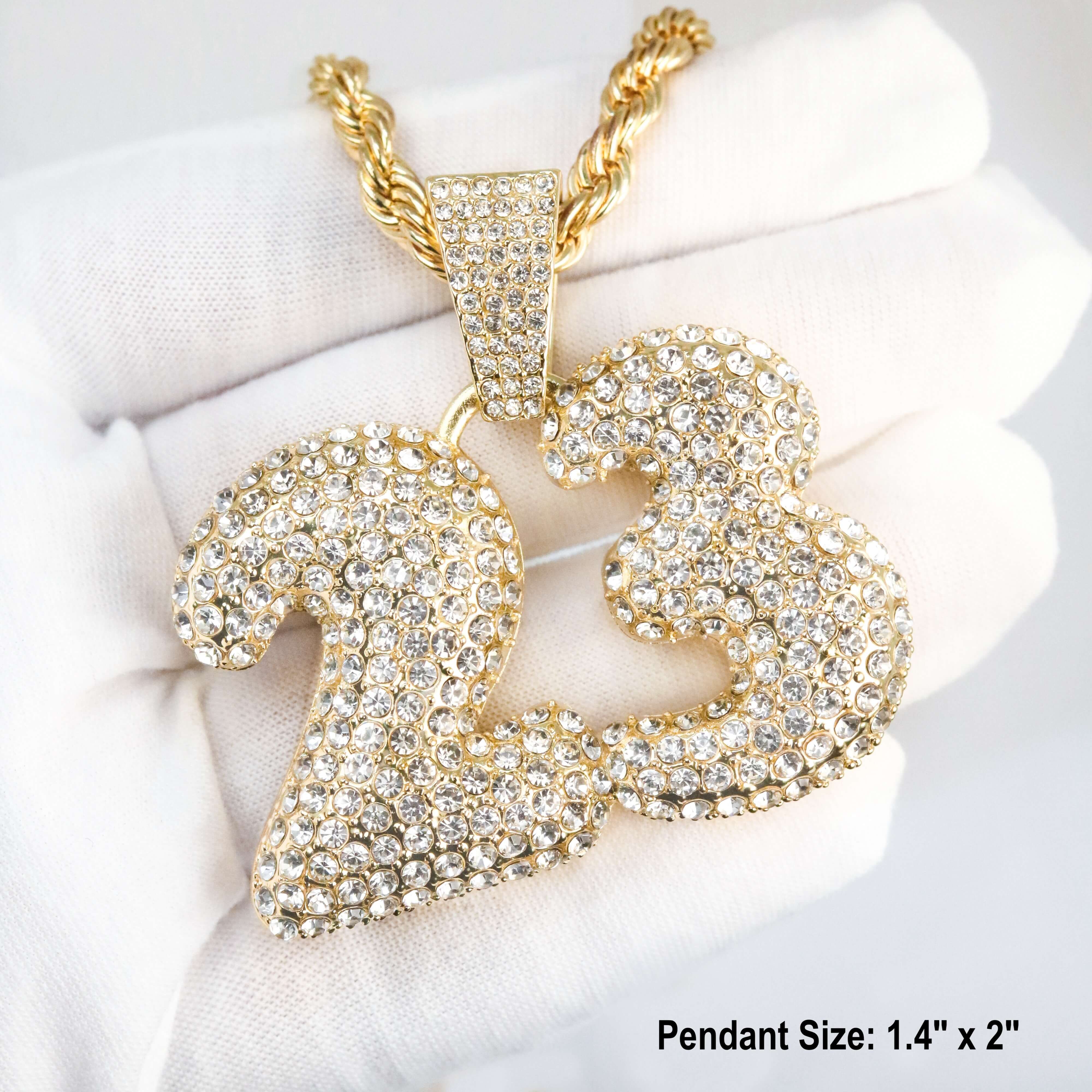Close-up of gold Men's iced out Number 23 pendant with handset stones and rope chain detail.