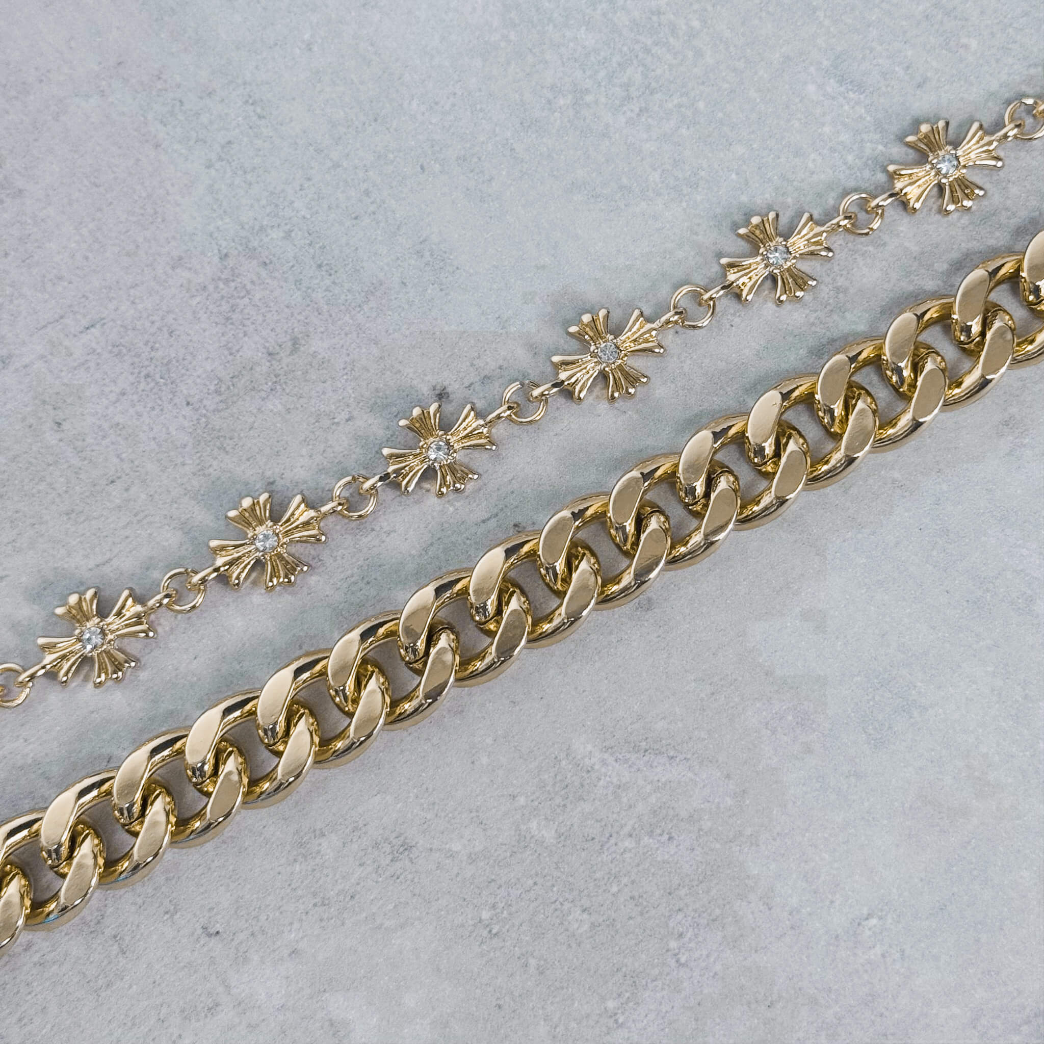 Close-up of gold Cuban chain and Cross with Cuban Double Link Pant Chain.