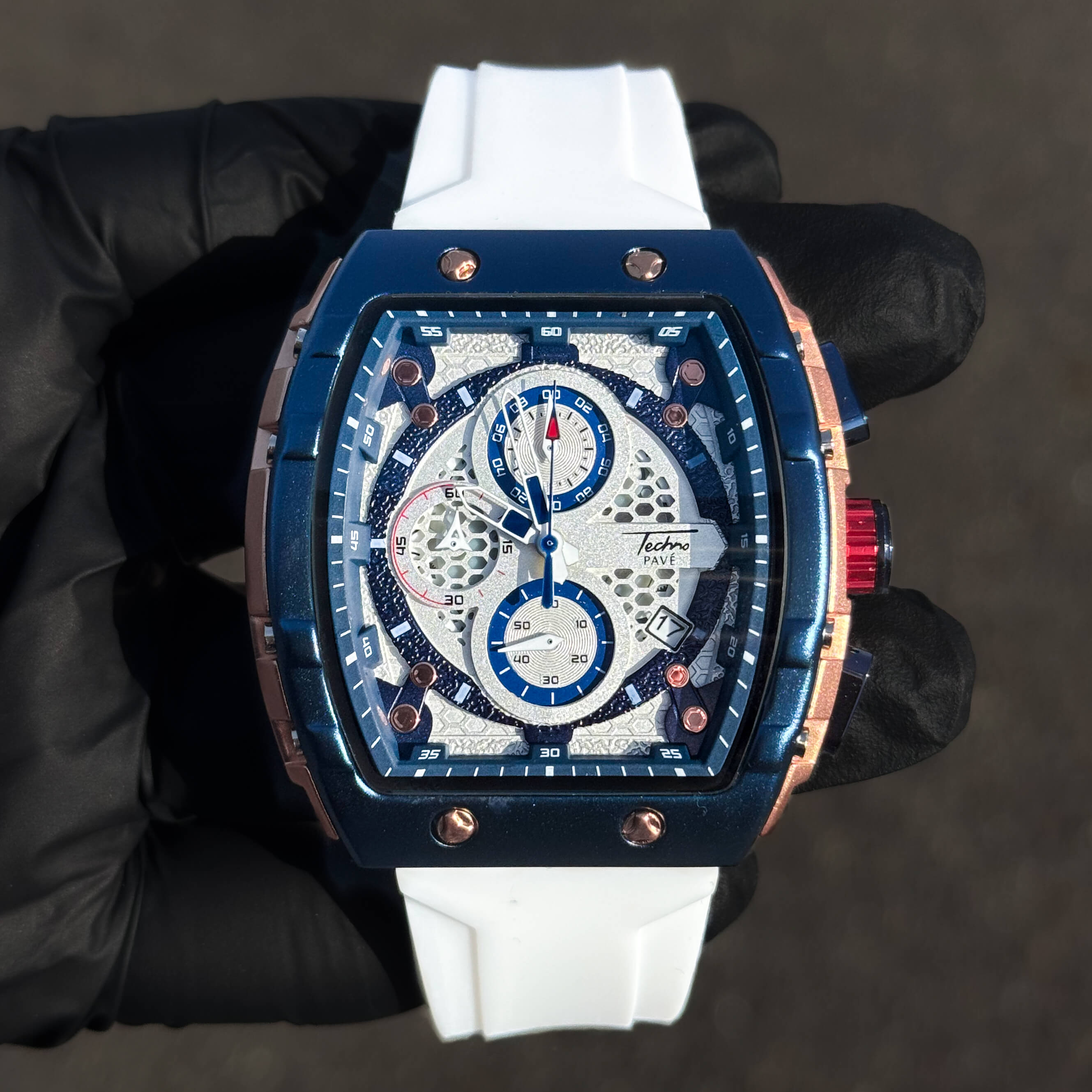 Men's 46mm sporty tonneau watch with white silicone band and blue multi-dial chronograph face.