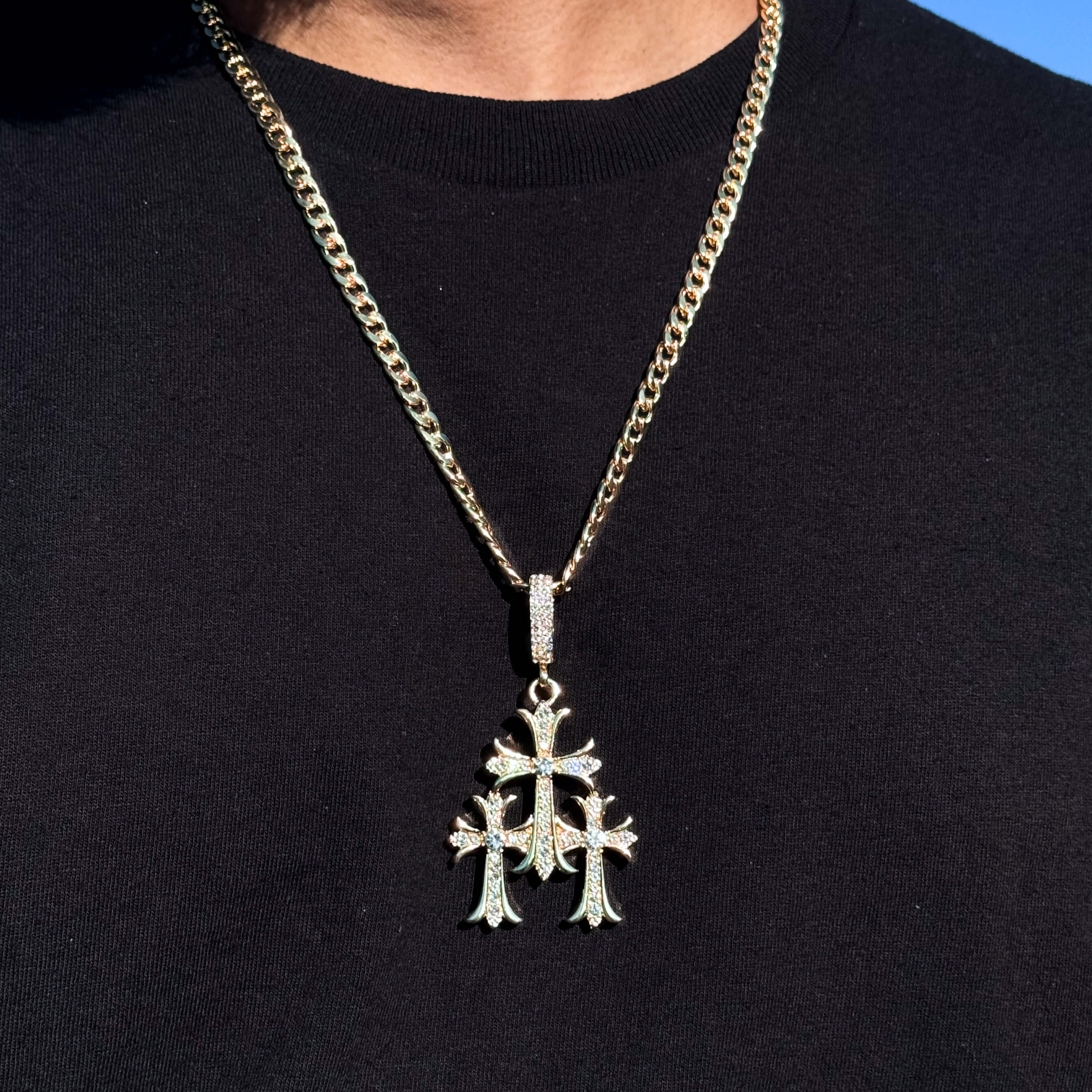 Gold Men's large iced out triple cross pendant with 5mm Cuban necklace shown worn for size reference.