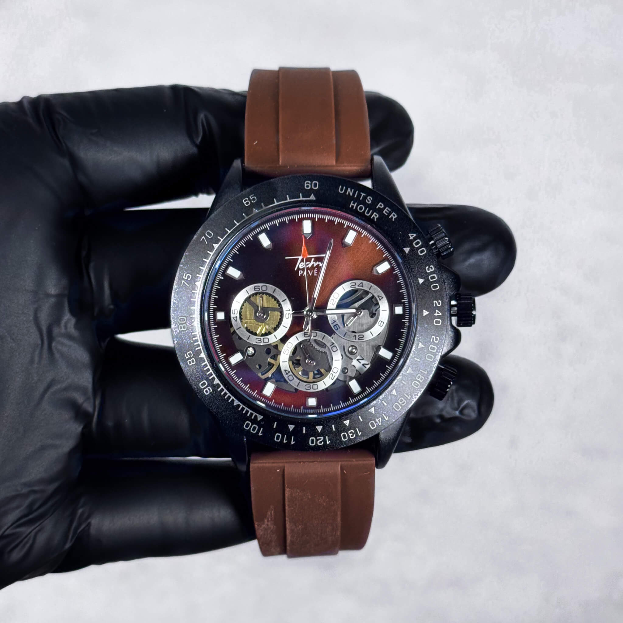 Brown-band Men’s 42mm silicone chronograph-style watch with gradient brown dial and quartz movement.