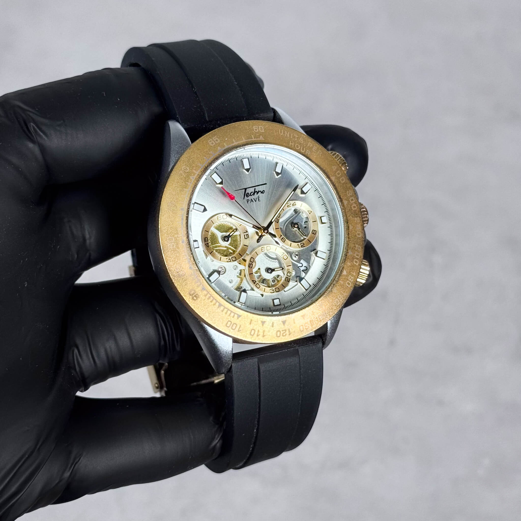 Gold-tone Men’s 42mm silicone chronograph watch featuring a white quartz multi-dial display.