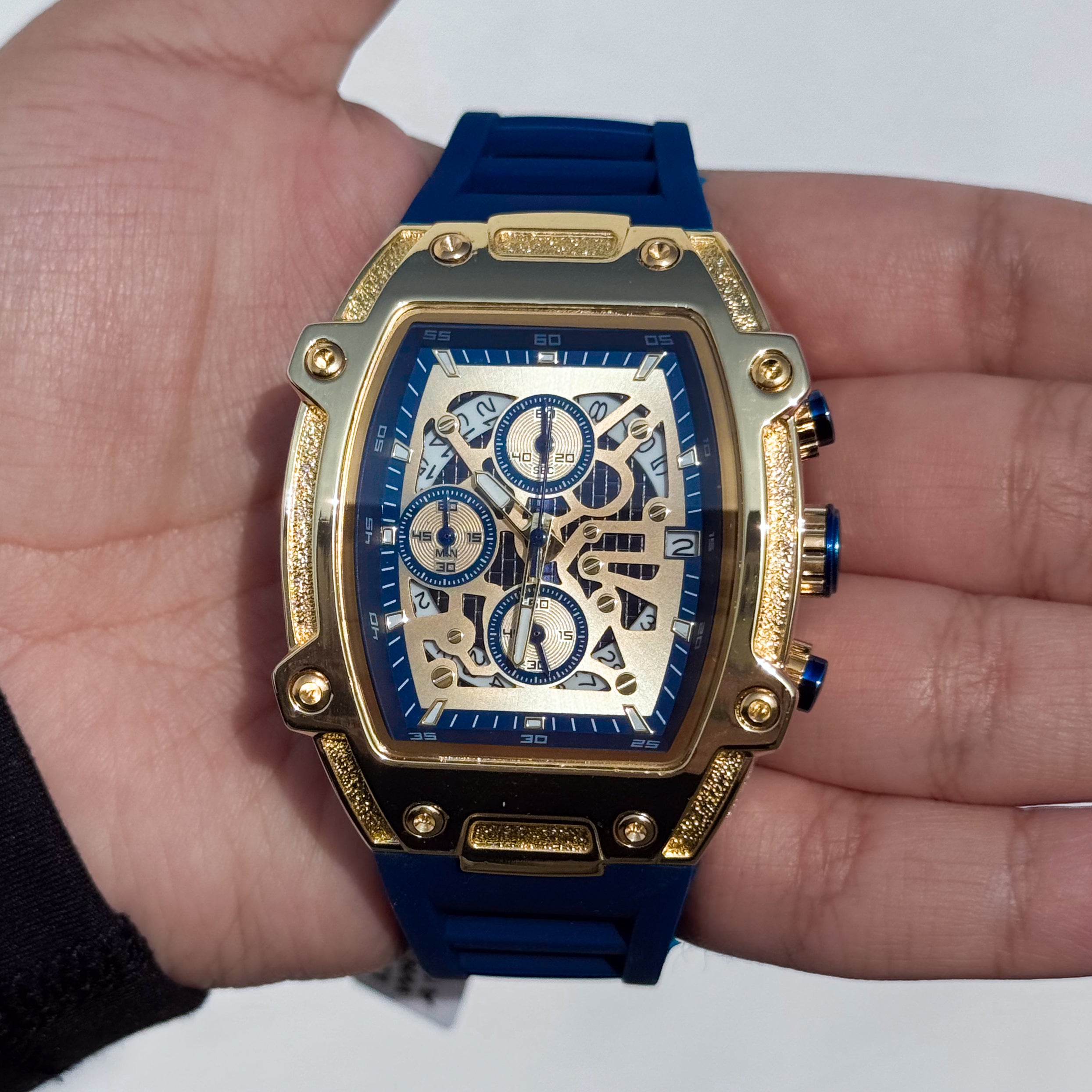 Blue Men's 41mm silicone band watch with gold tonneau case and detailed skeleton-style quartz dial.