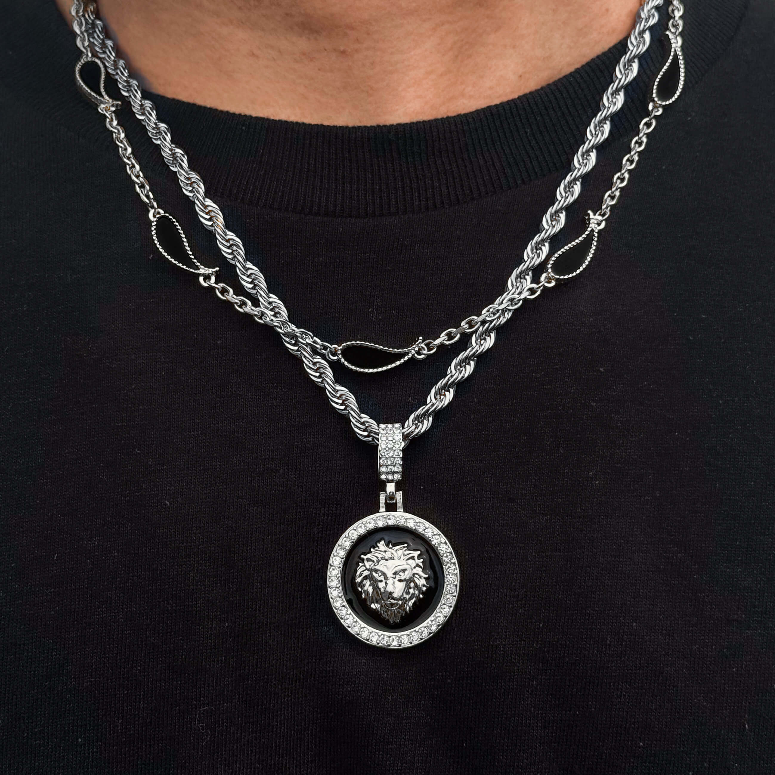 Silver lion medallion necklace with black enamel center and crystal border, included in 2-piece set
