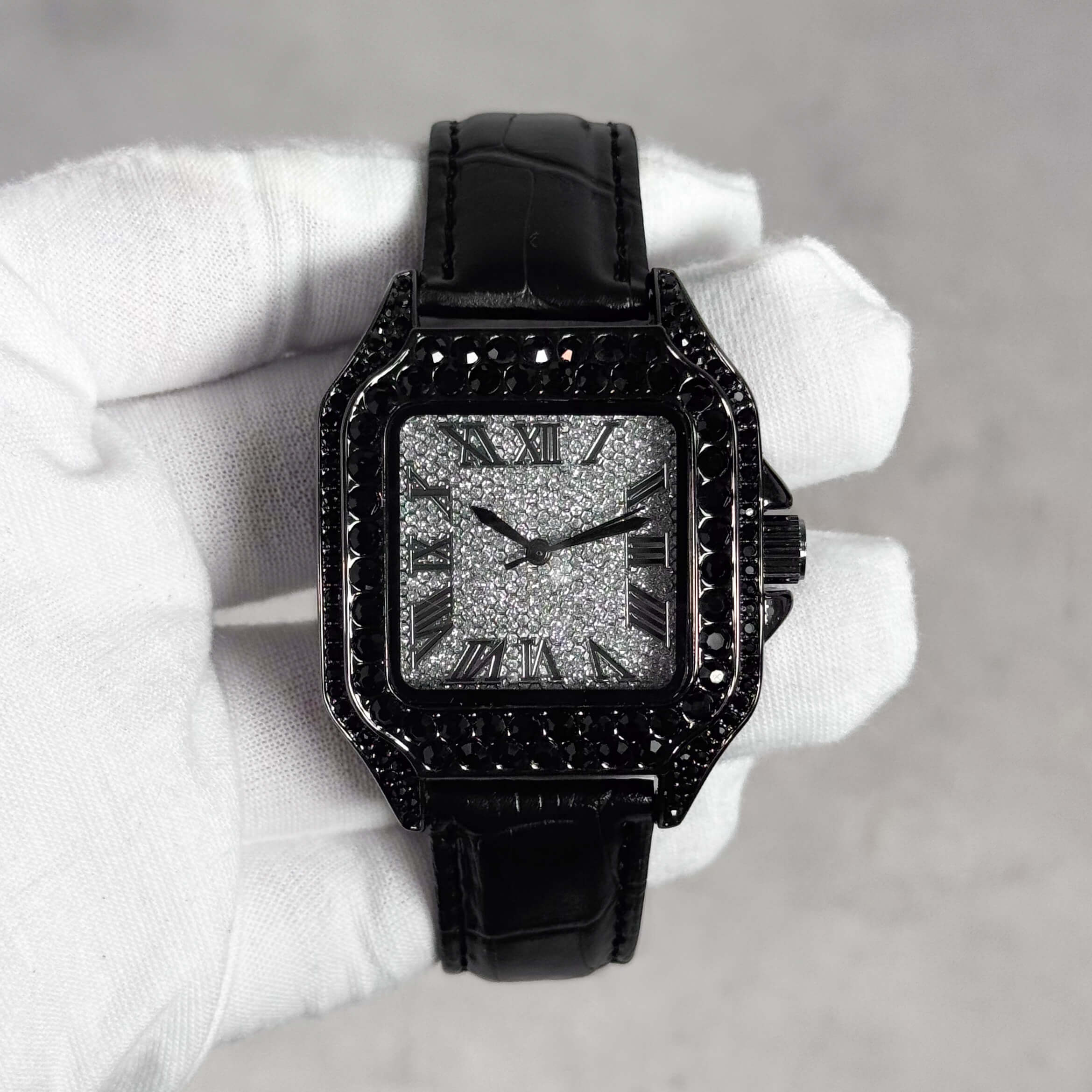 Men's 32mm black iced out square dial watch with dark crystal bezel and black leather band front.