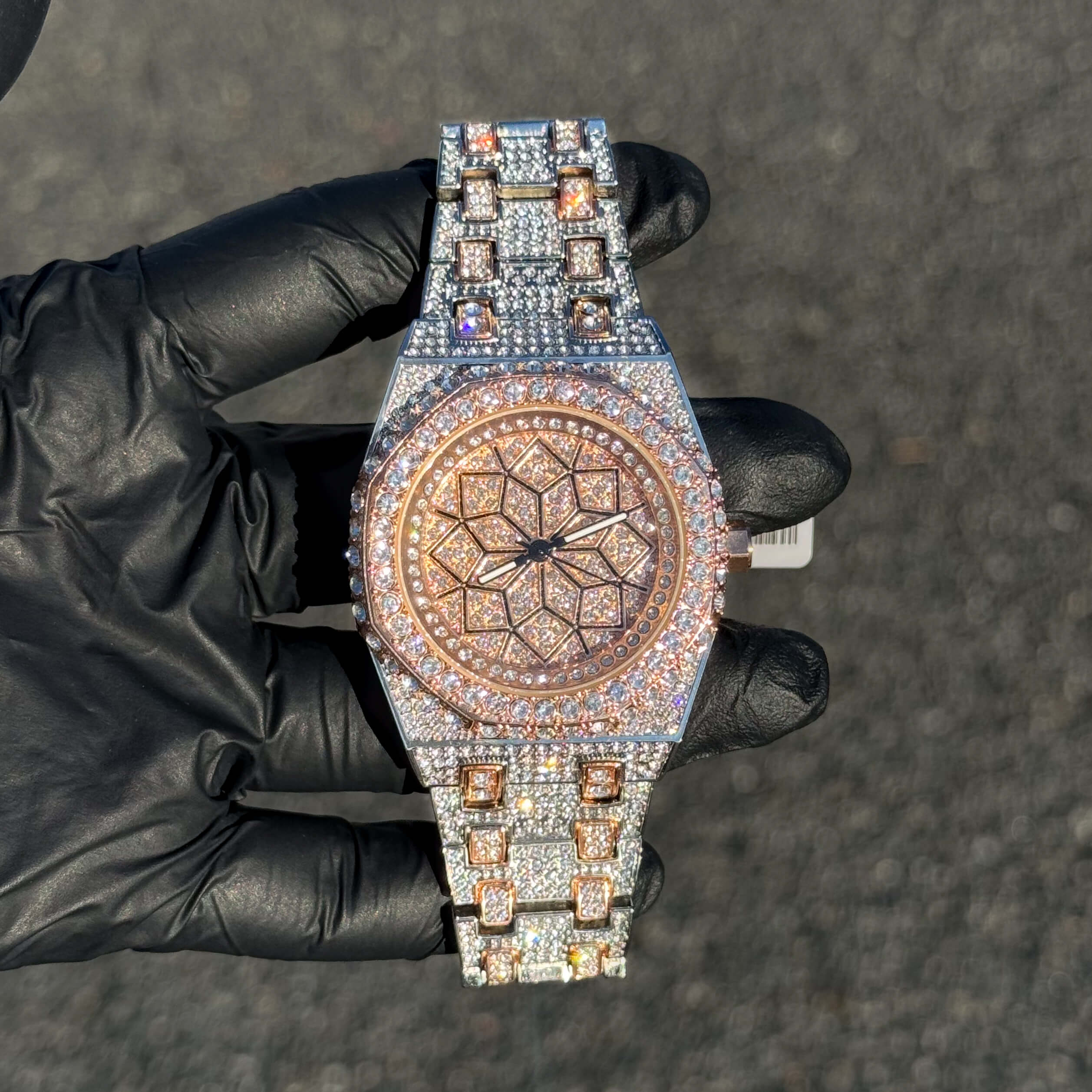Men's 43mm rose gold iced out octagon shape watch with crystal bezel and luxury bracelet design.