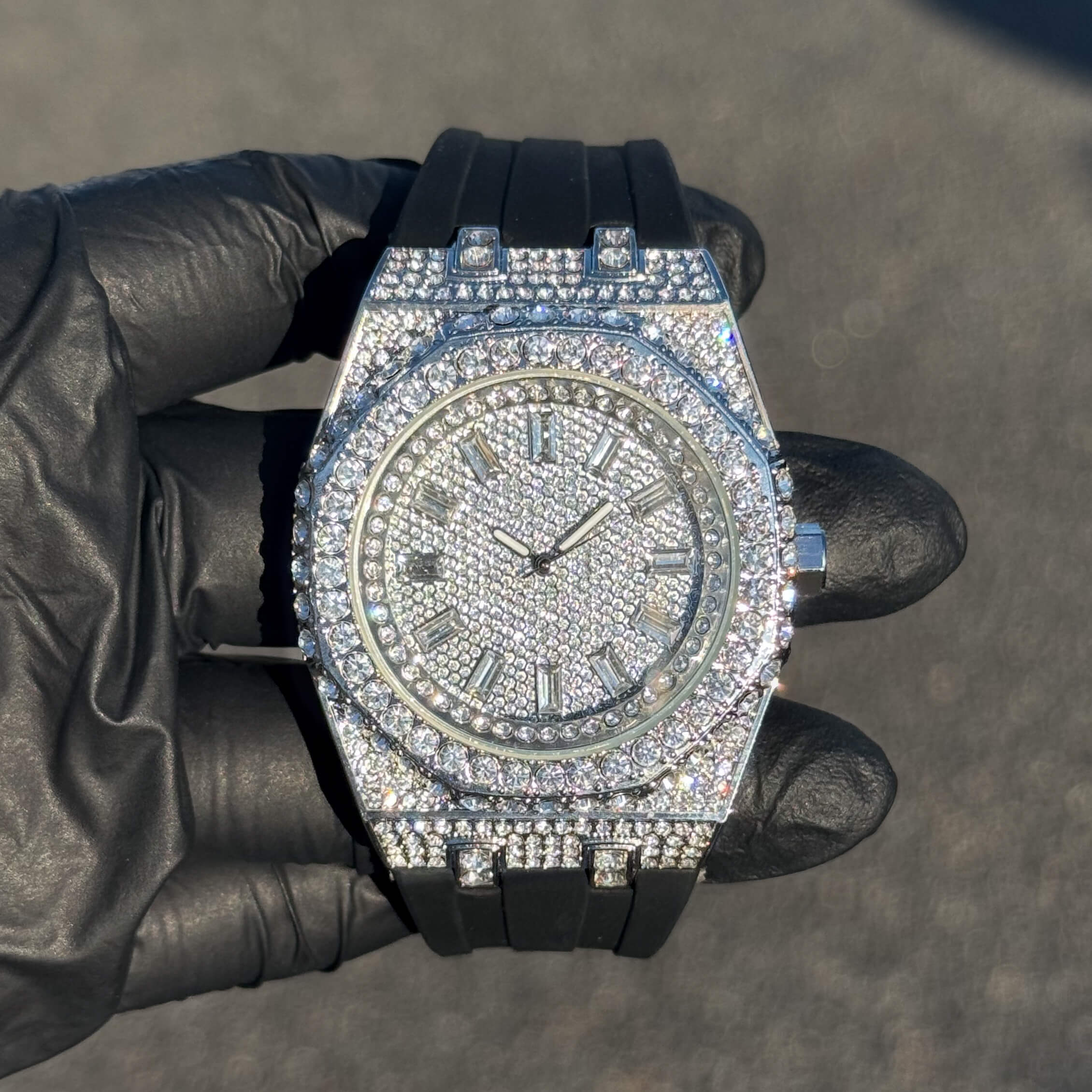 Silver men's 43mm iced out octagonal dial watch with full diamond bezel and silicone band.