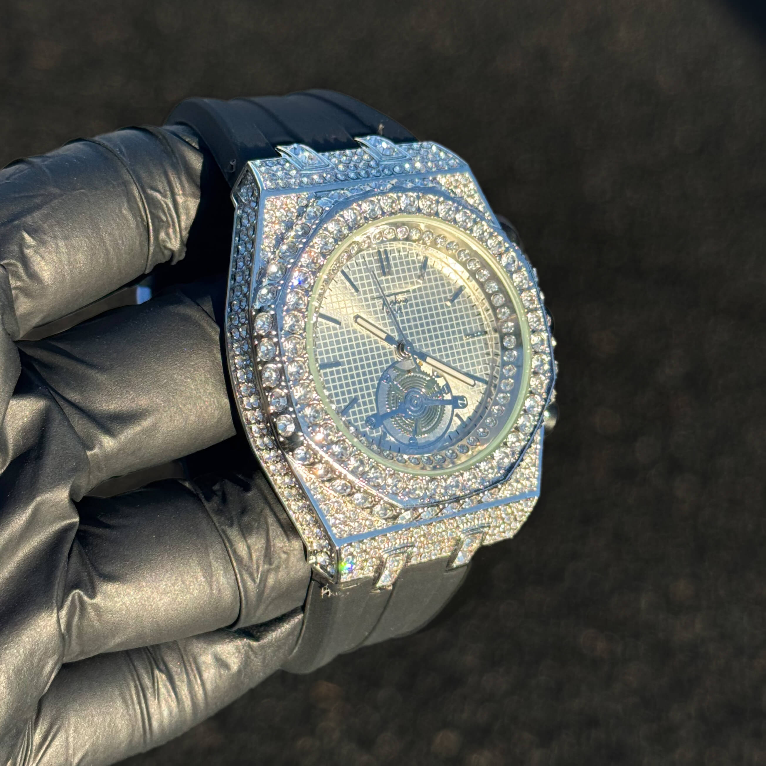 Men's 43mm silver iced out octagonal watch displayed at an angle with full crystal detailing.