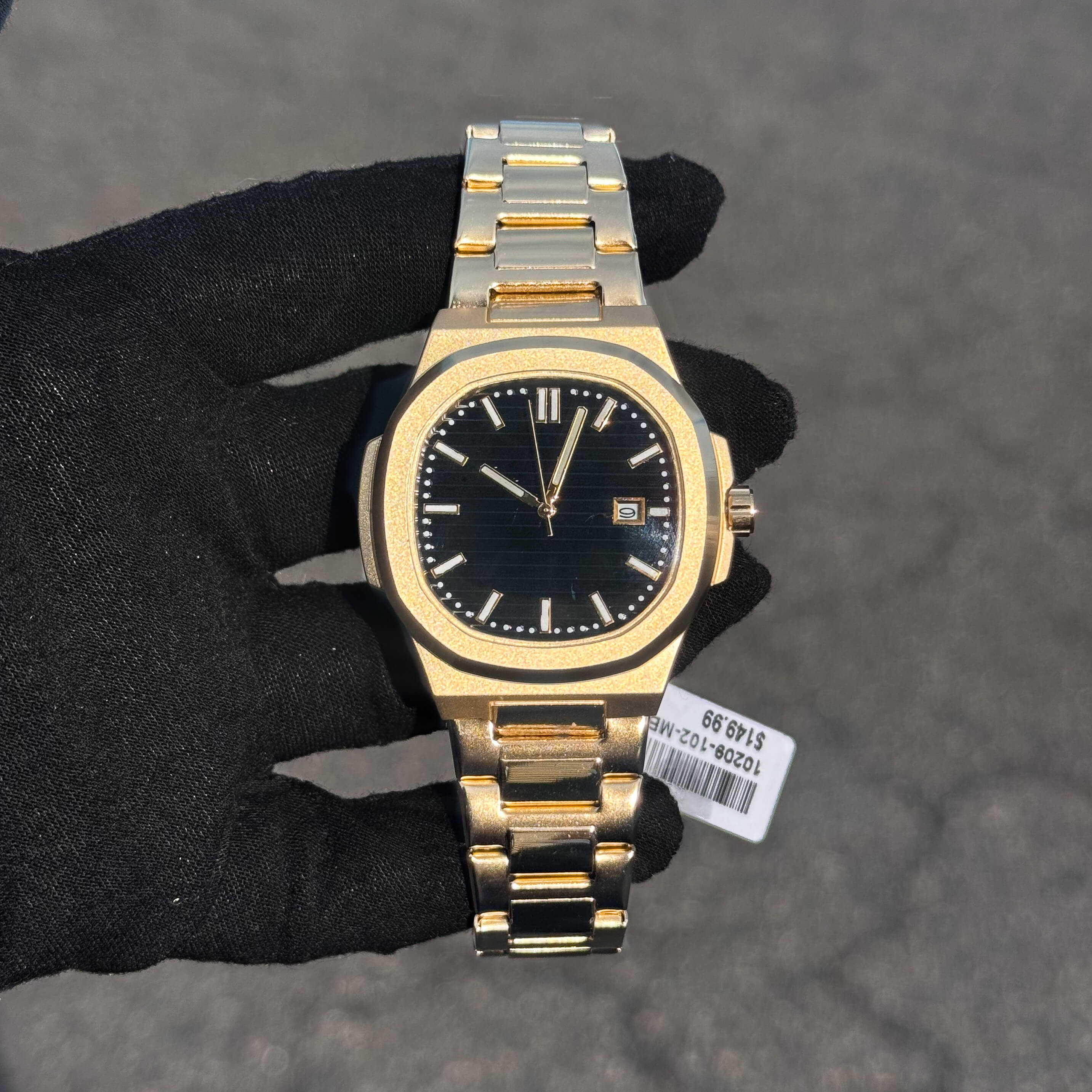 Men’s 42mm Classic Oblong Dial Watch with black dial, gold case, and stainless steel bracelet.