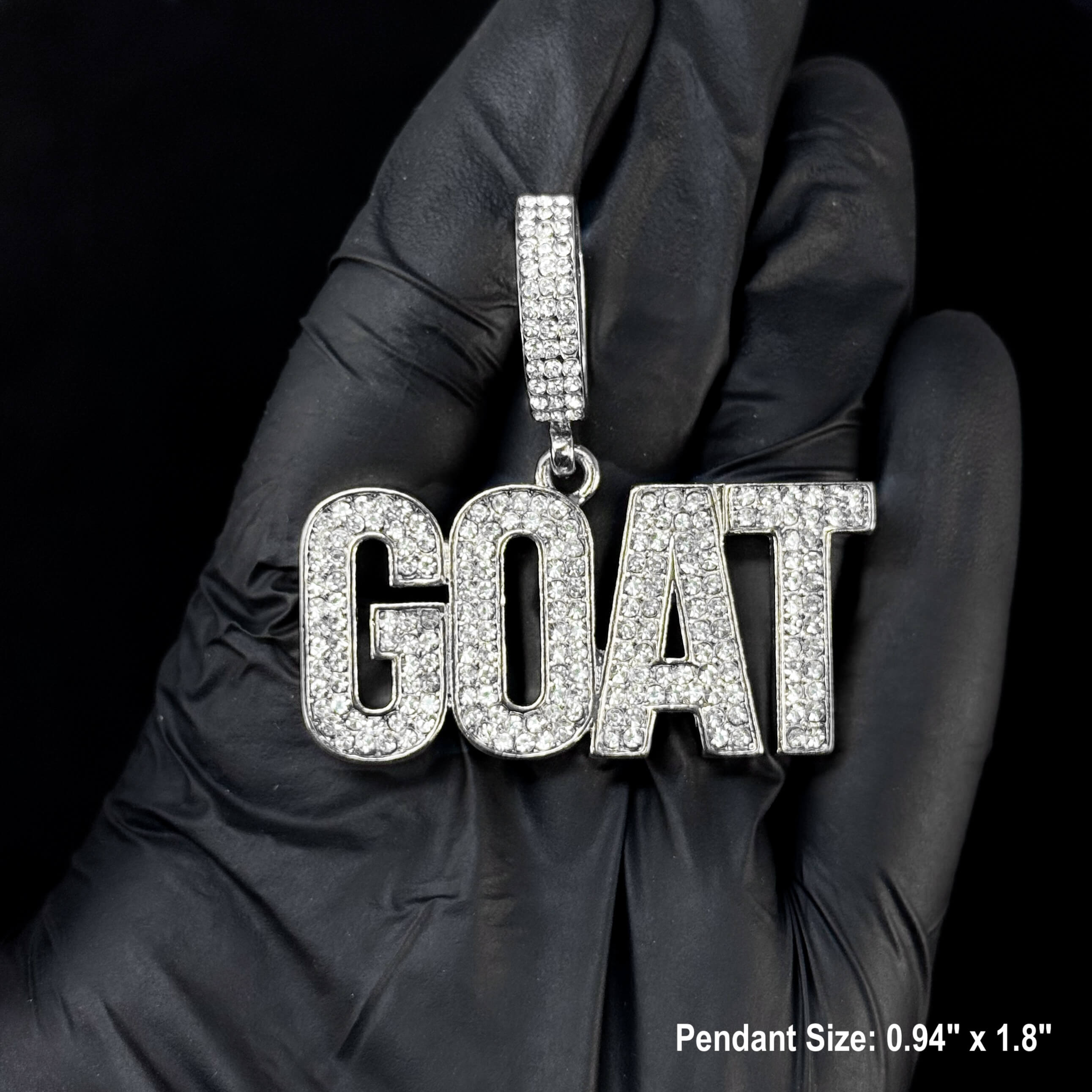 Silver iced-out GOAT pendant close-up with shimmering stones and bold statement