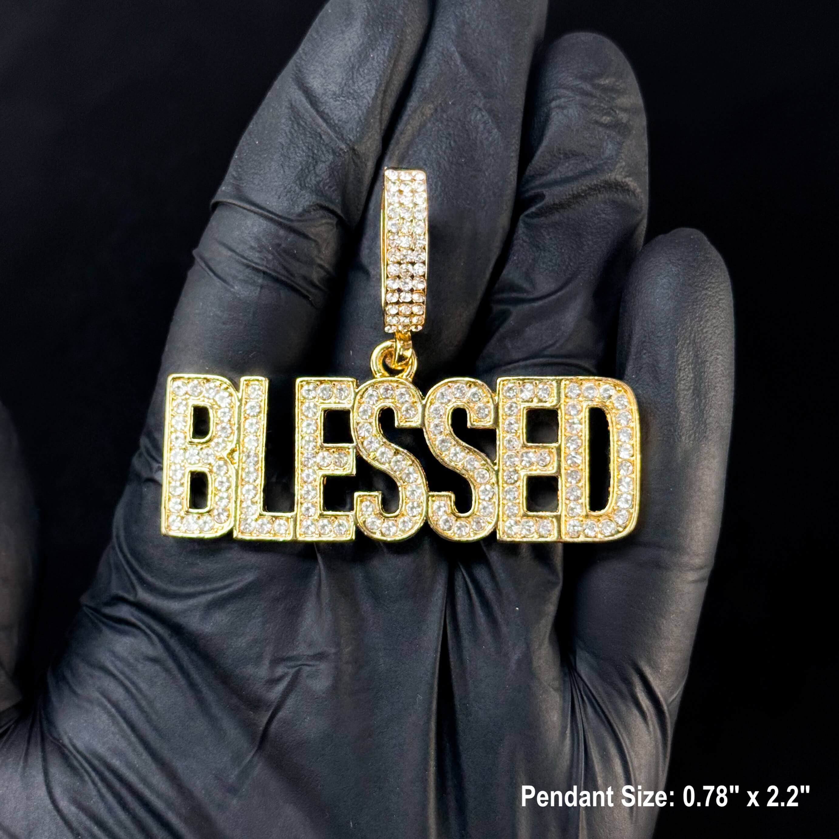 Gold Men's iced out Blessed pendant with handset stones shown close-up for hip hop chain jewelry.