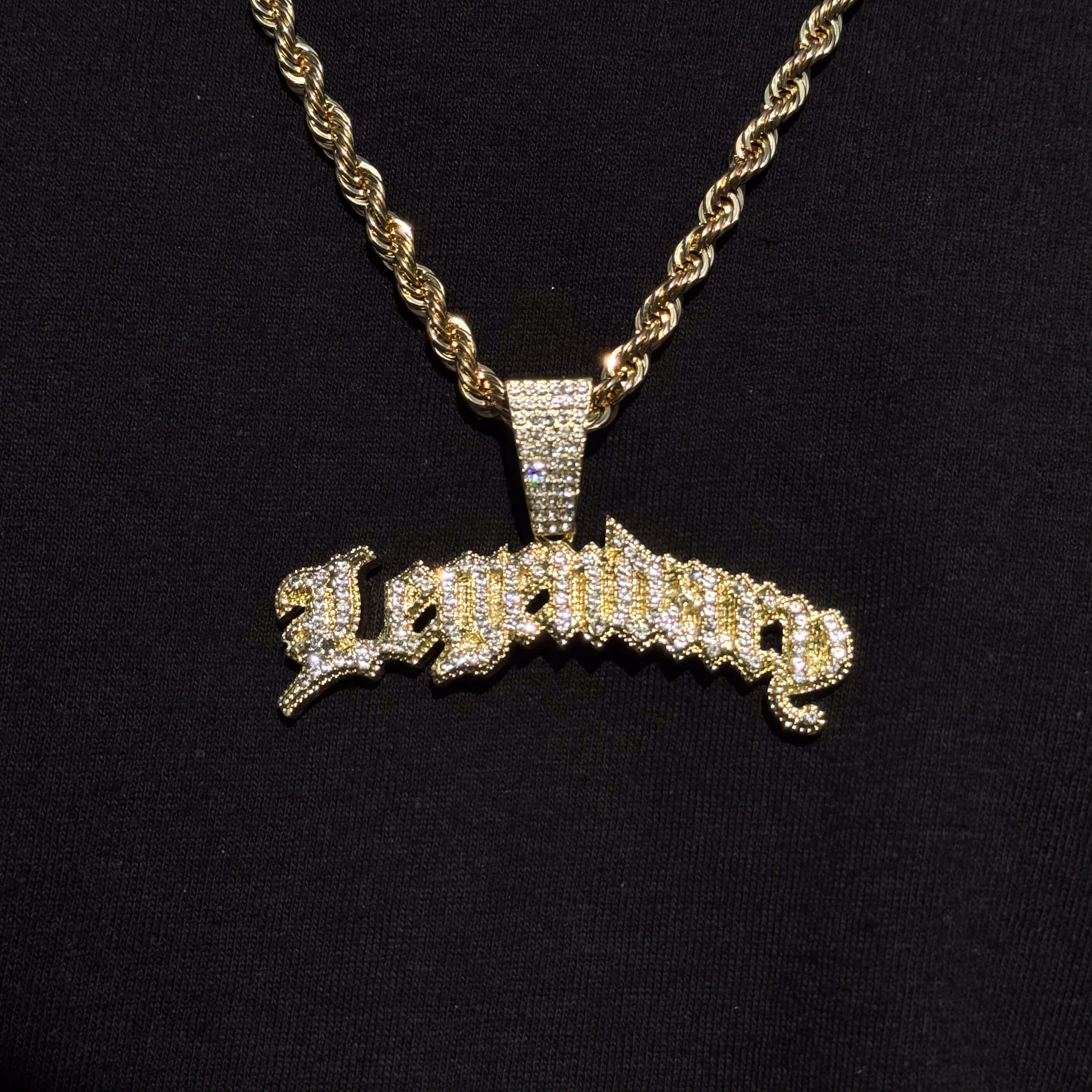 Gold Men's Large Iced Out Legendary pendant with rope necklace featuring shimmering.