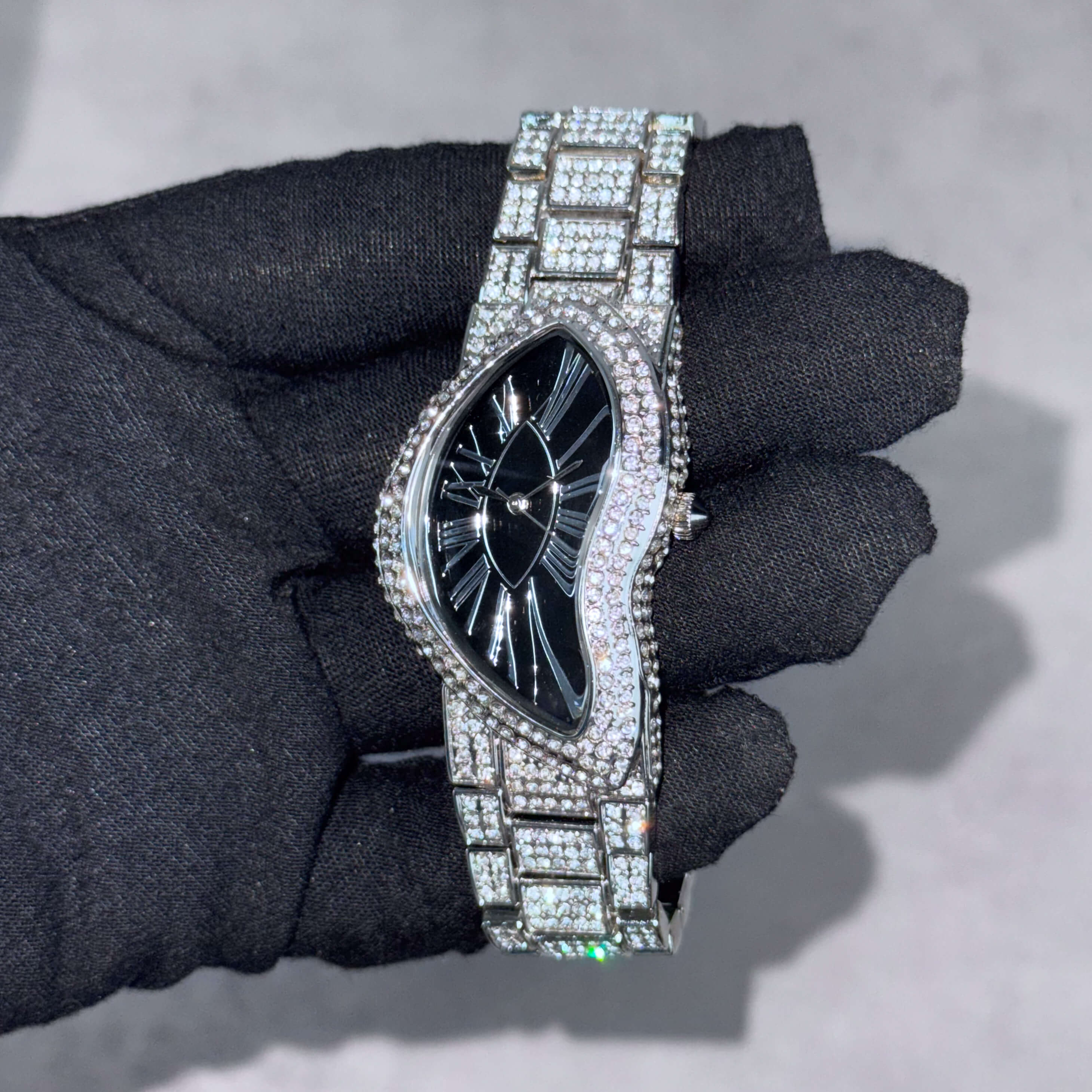 Men's 30mm fully iced-out warped watch in silver with black dial and pavé bezel for bold luxury.