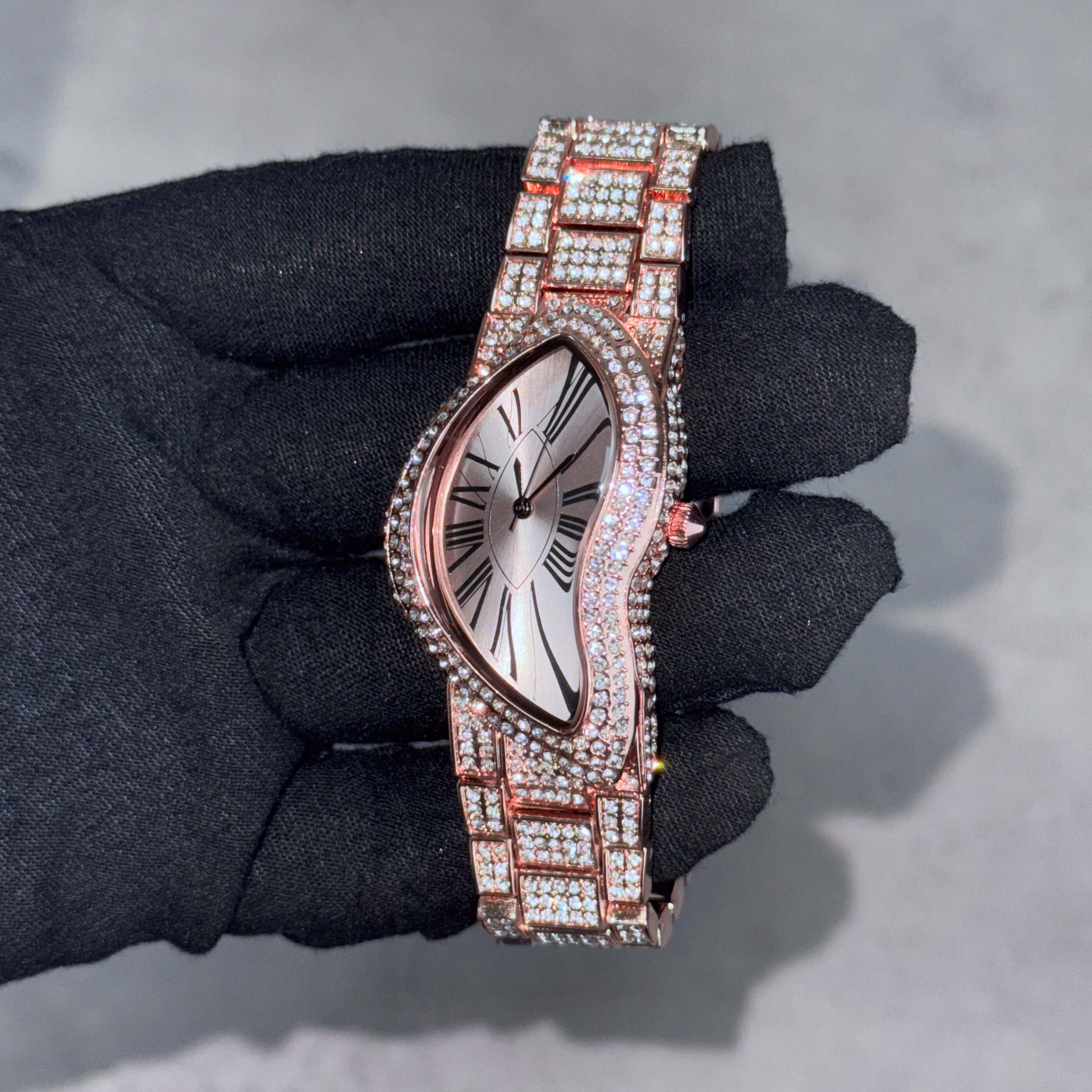 Men’s 30mm rose gold warped watch with fully iced-out bracelet and curved dial design for luxury style.