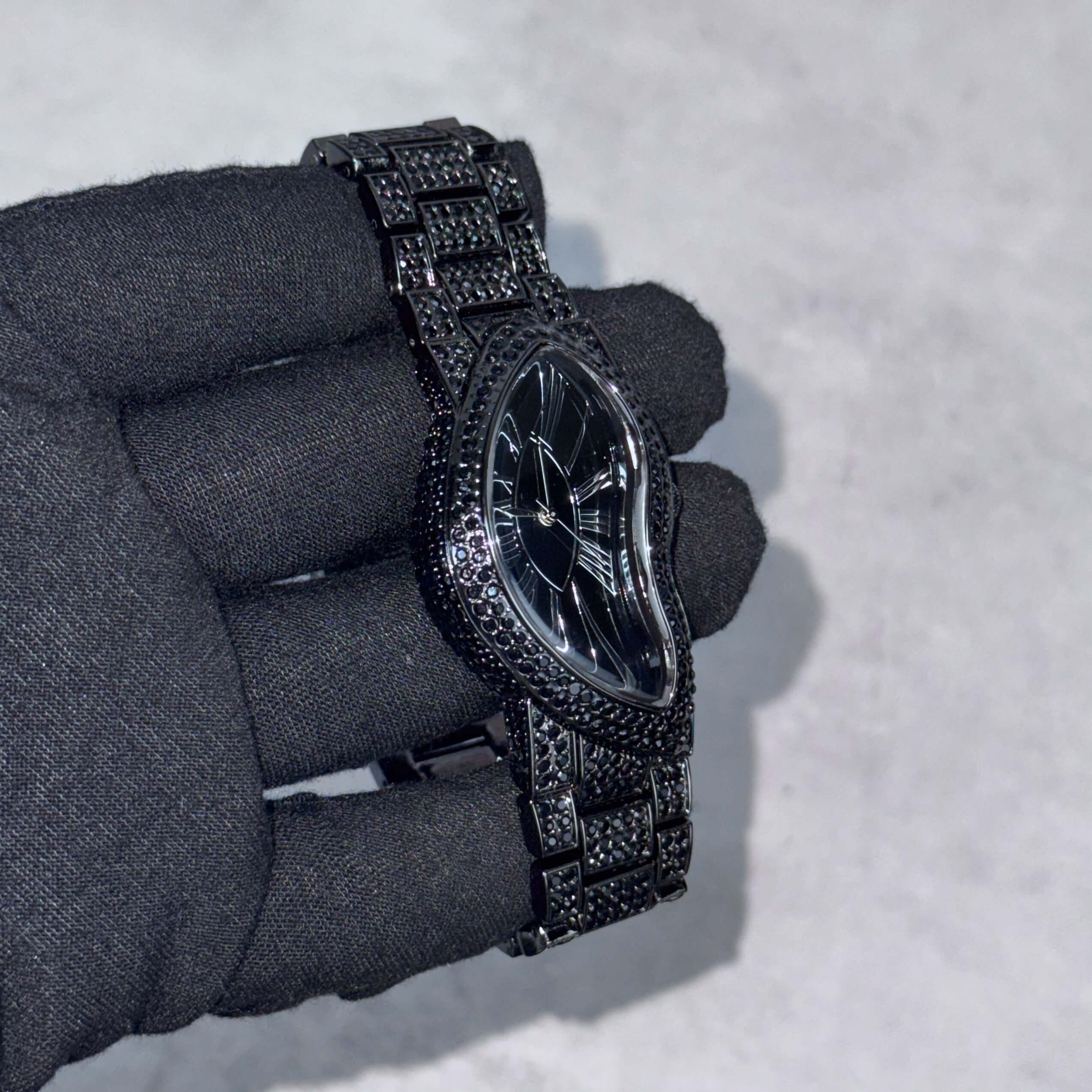 Men's 30mm black iced-out watch band with square pavé links for a bold, premium jewelry finish.