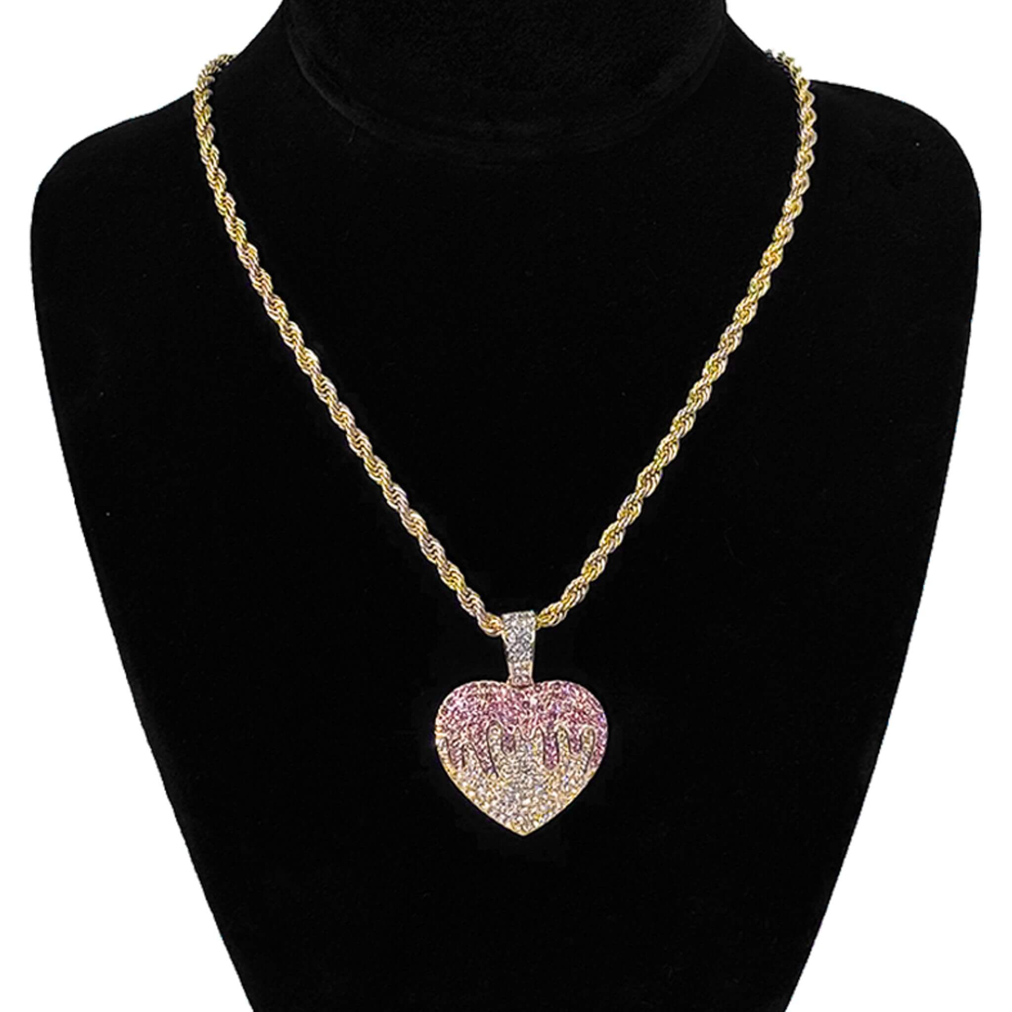 Close-up of gold iced-out 32mm Heart pendant featuring pavé crystals and polished finish for women.