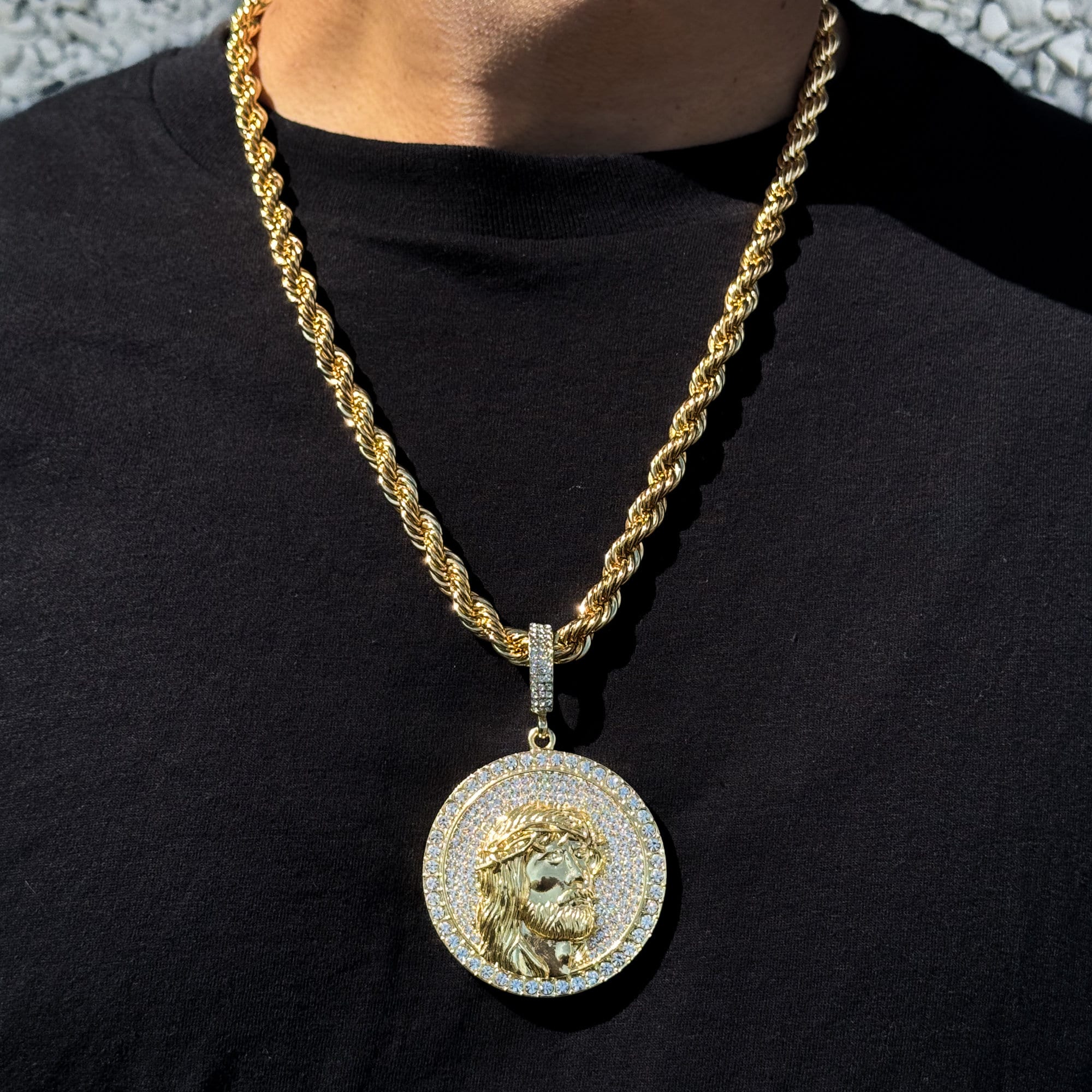 Men’s large iced-out Jesus medallion pendant in gold on an 8mm rope chain with full crystal detailing.