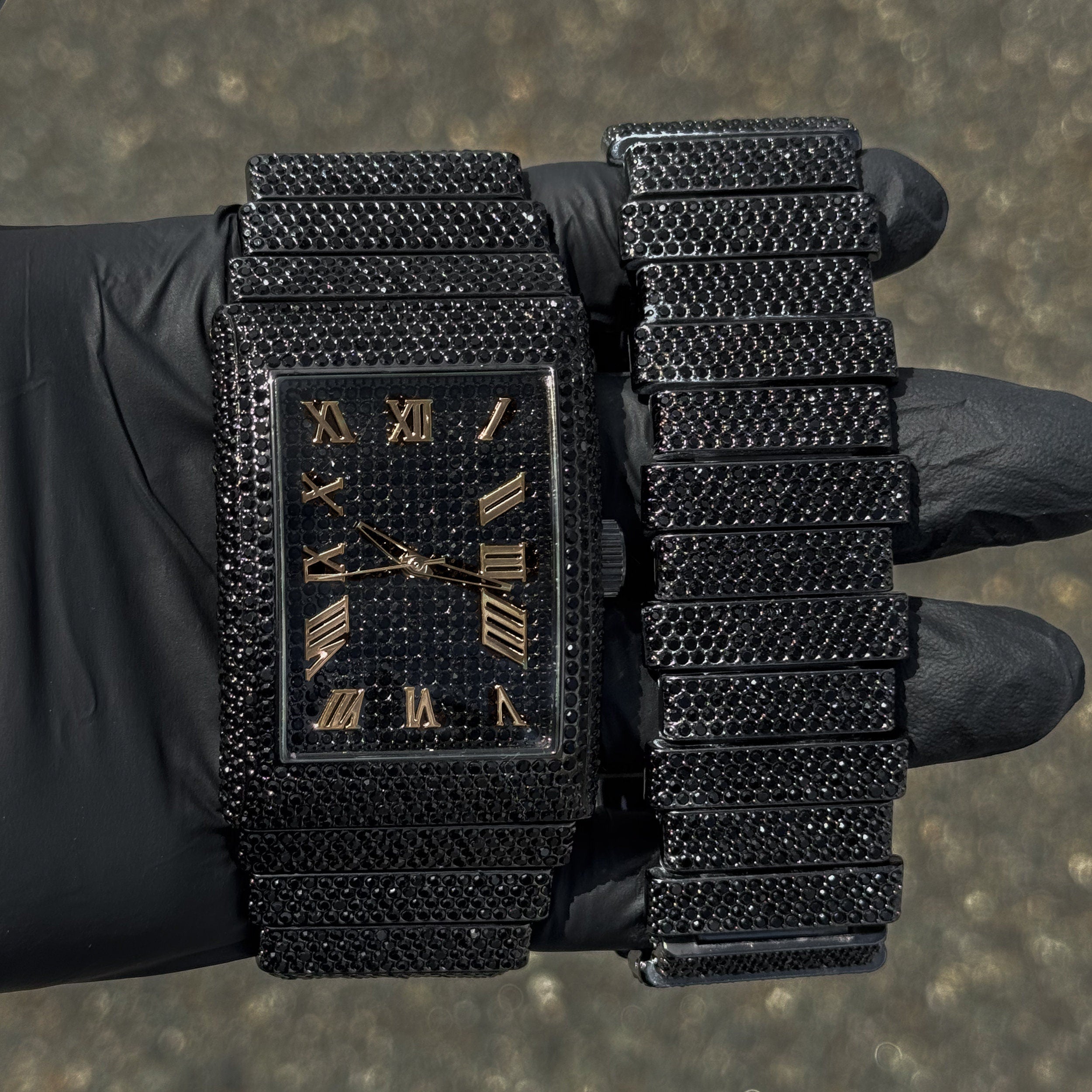 Men's 40mm black fully iced out diamond watch and matching staggered link bracelet two-piece set.