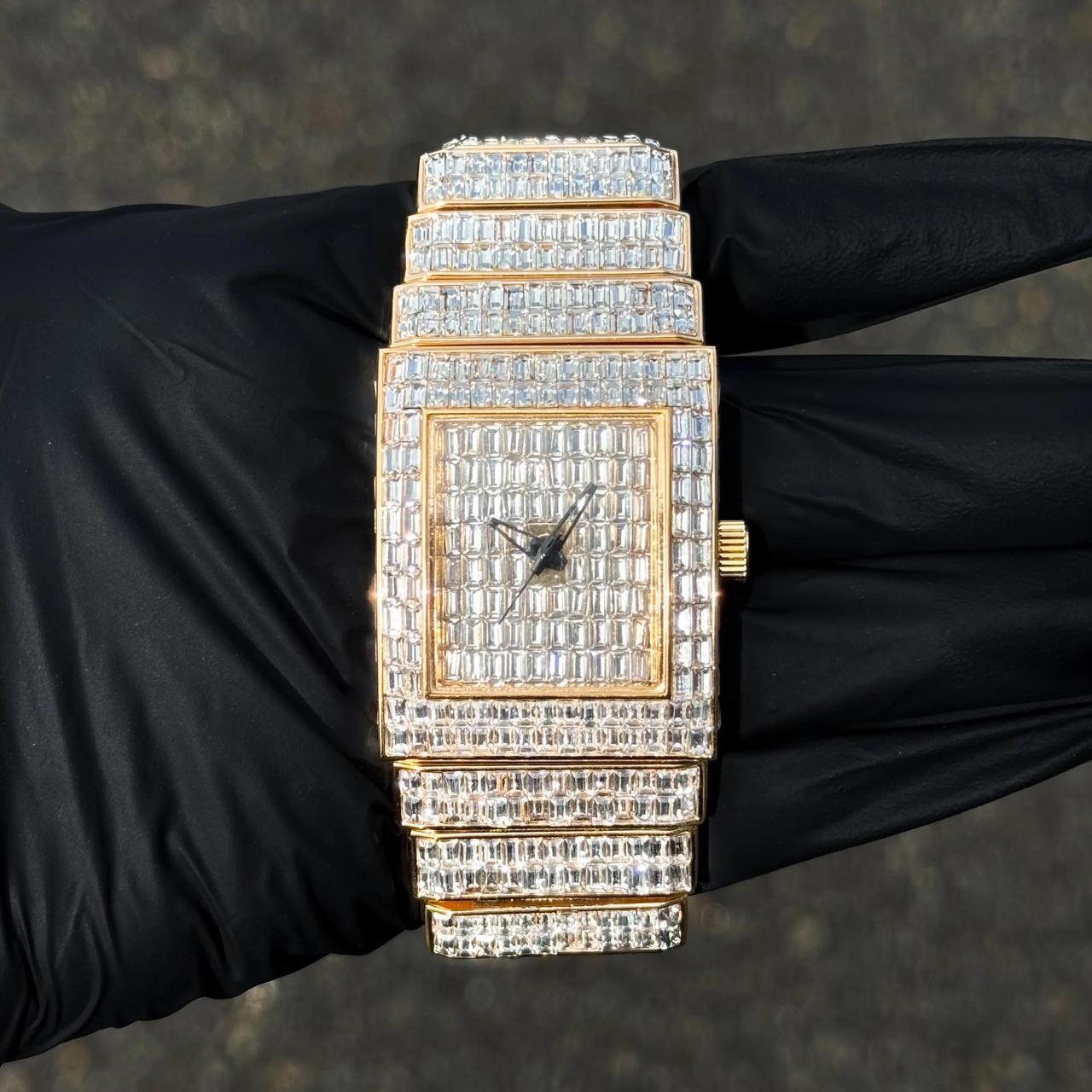 Women's 30mm gold fully iced-out diamond watch with square baguette dial and matching band.