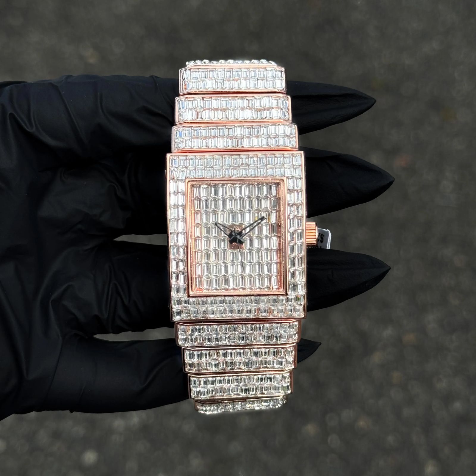 Rose gold Women's 30mm iced-out diamond watch with baguette-set square dial and iced band.