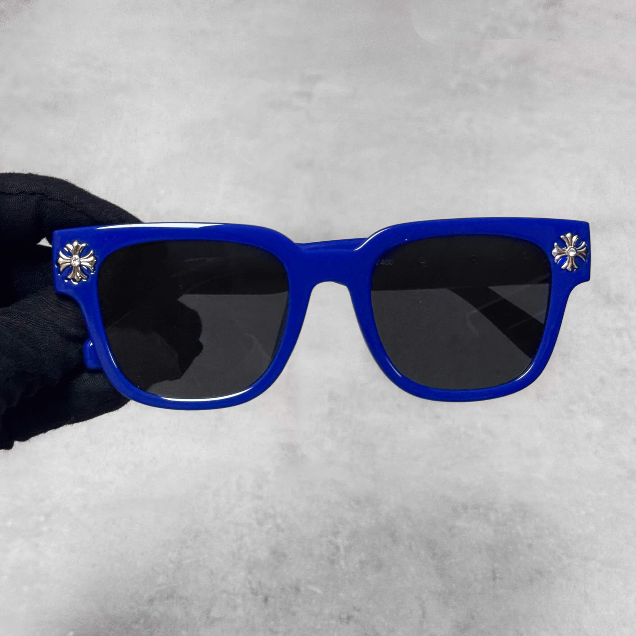 Blue frame Cross Chrome Inspired Sunglasses with smoke lenses and silver cross accents.