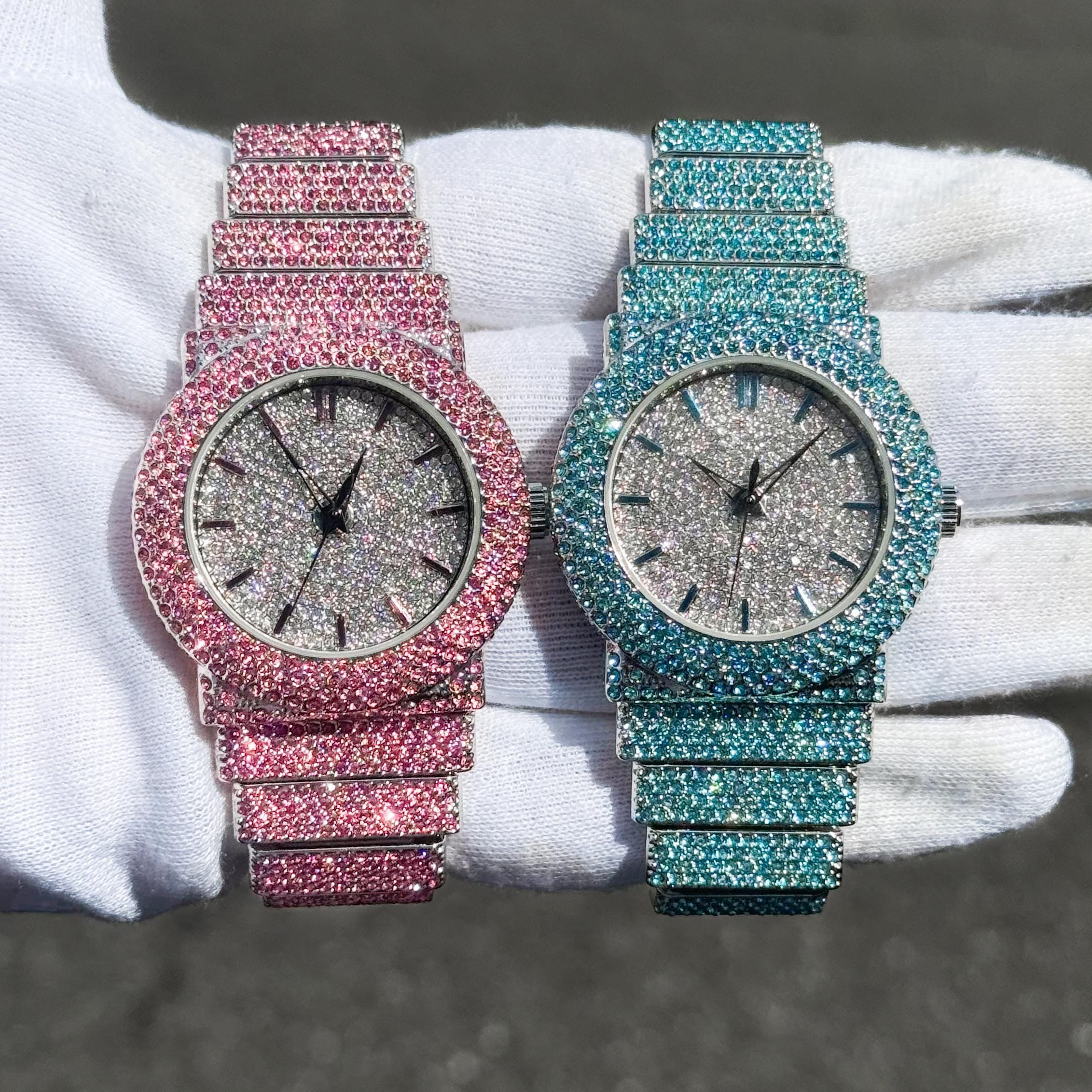 Women's 40mm iced diamond watches in pink and aqua with fully iced bands and brilliant crystals.