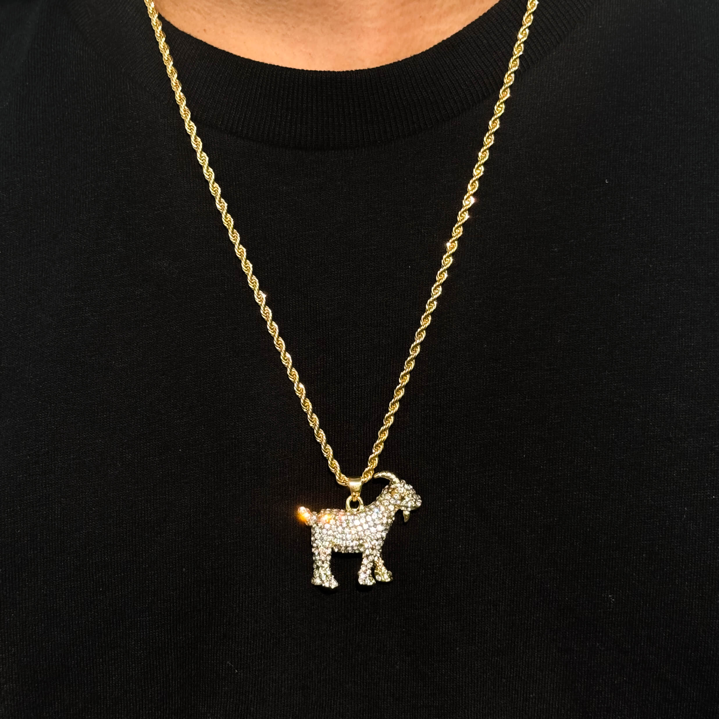 Men's gold iced out GOAT pendant on 4mm rope necklace, sparkling animal design hip hop jewelry.