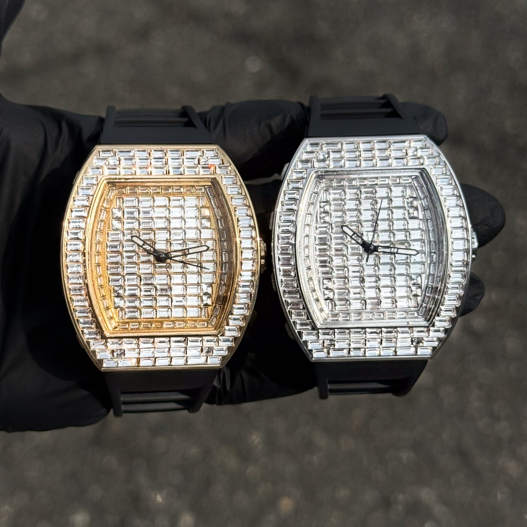 Men’s 43mm iced out tonneau watches in gold and silver finish with baguette crystals and silicone bands.