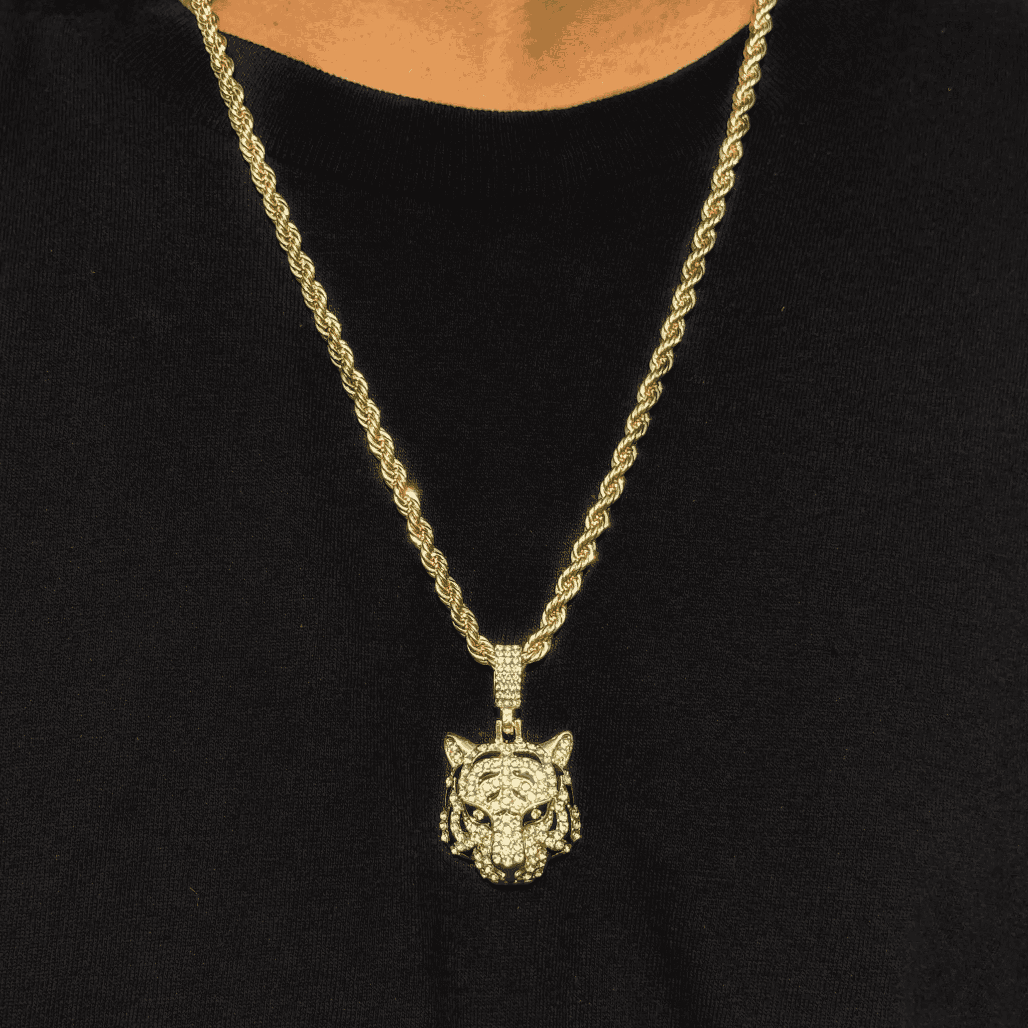 Gold men's iced out tiger pendant on 4mm rope chain with shimmering stones and bold detailing.
