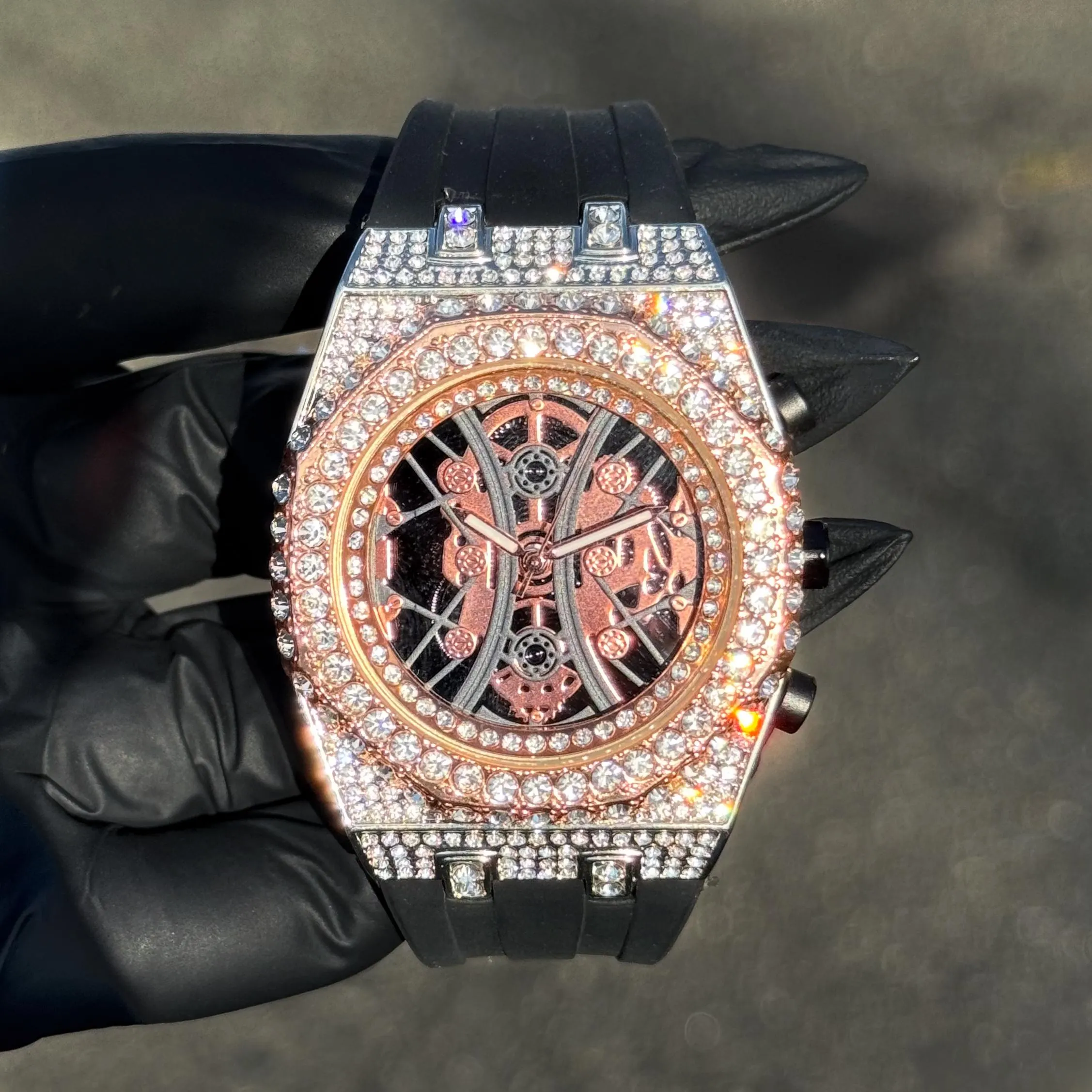 Men’s 43mm rose gold diamond watch with skeleton face and octagon bezel design.