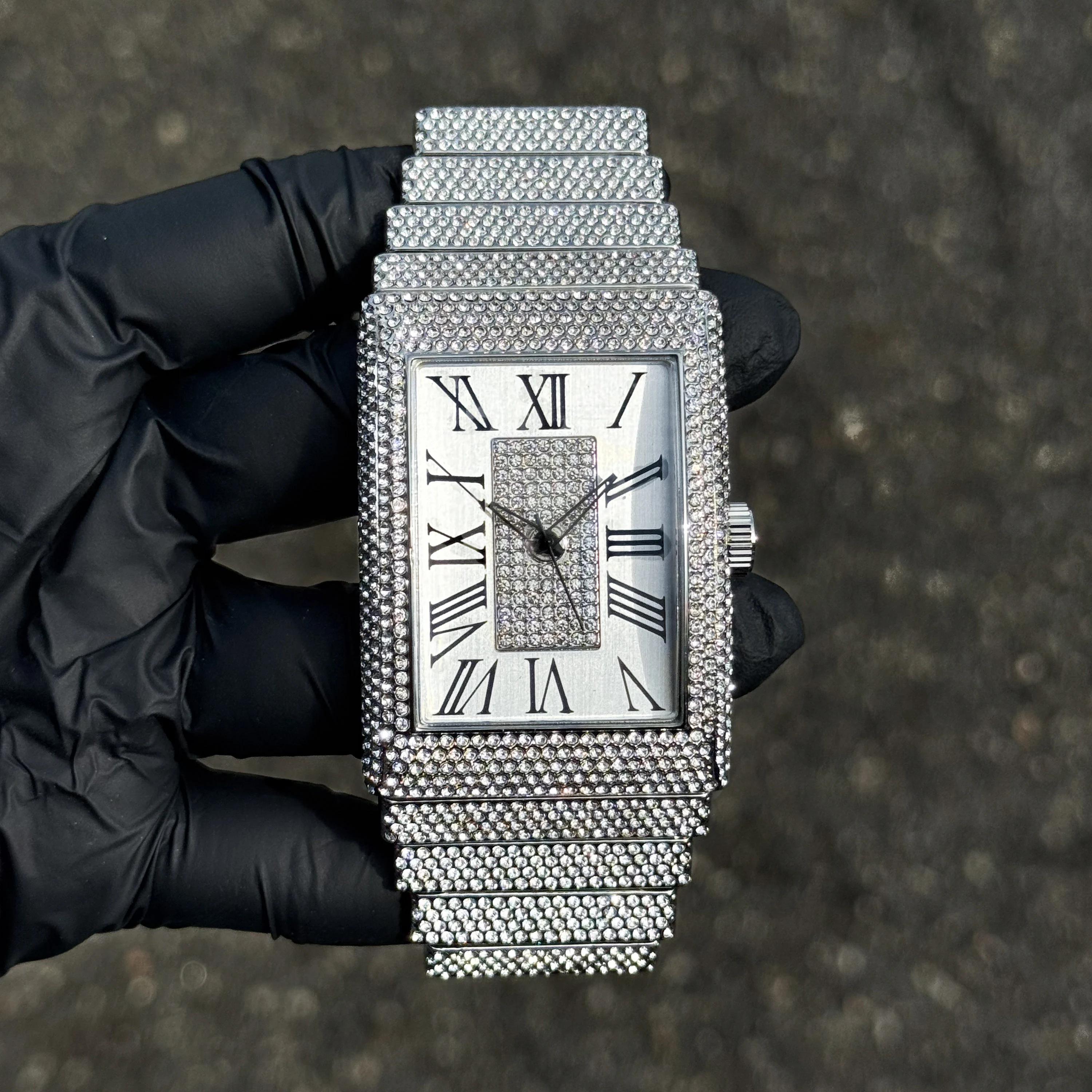 Silver 40mm men’s fully iced rectangle watch featuring diamond bezel, iced band, and Roman dial.
