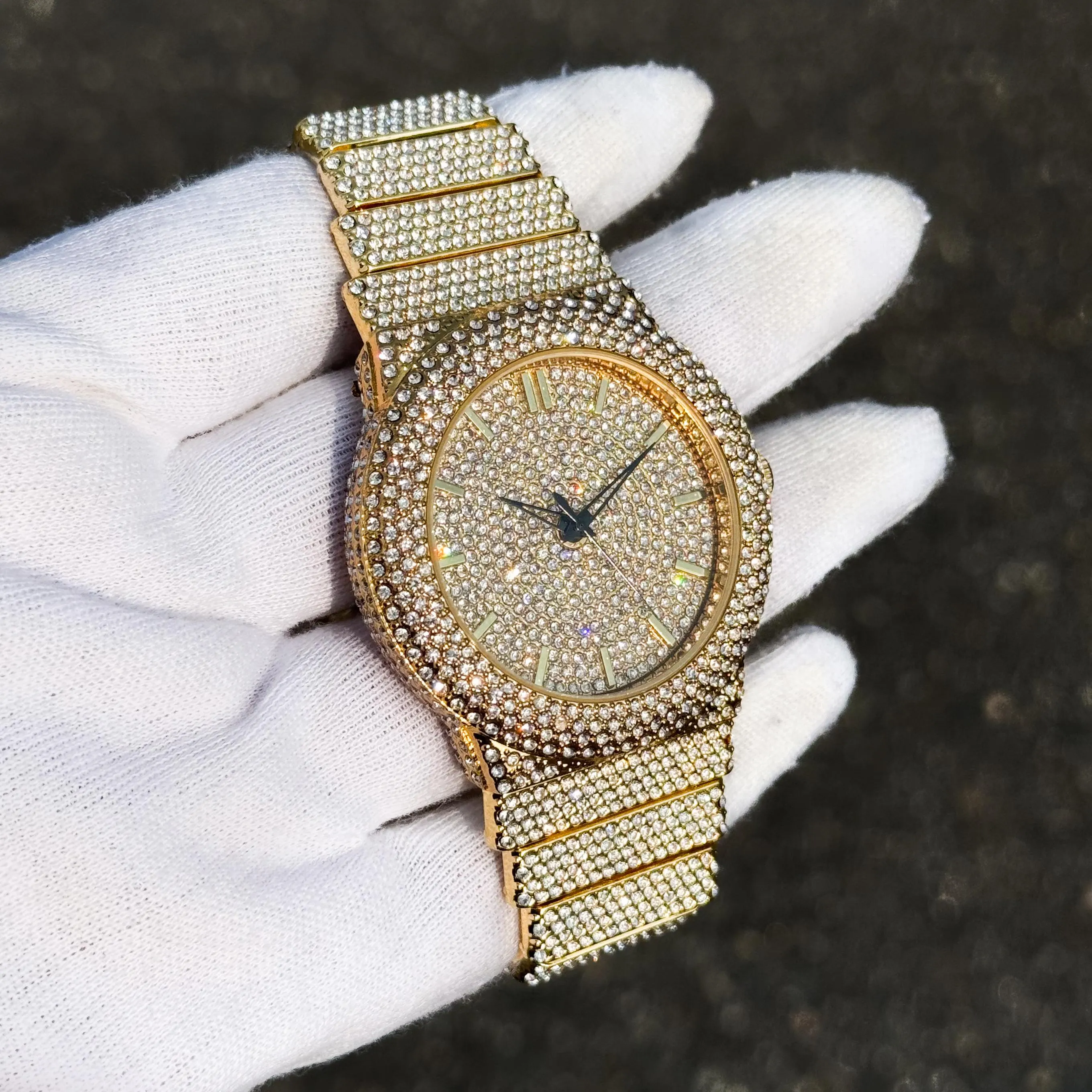 Angled view of gold men’s 46mm luxury diamond watch with iced-out band, bling dial, and crystal bezel.