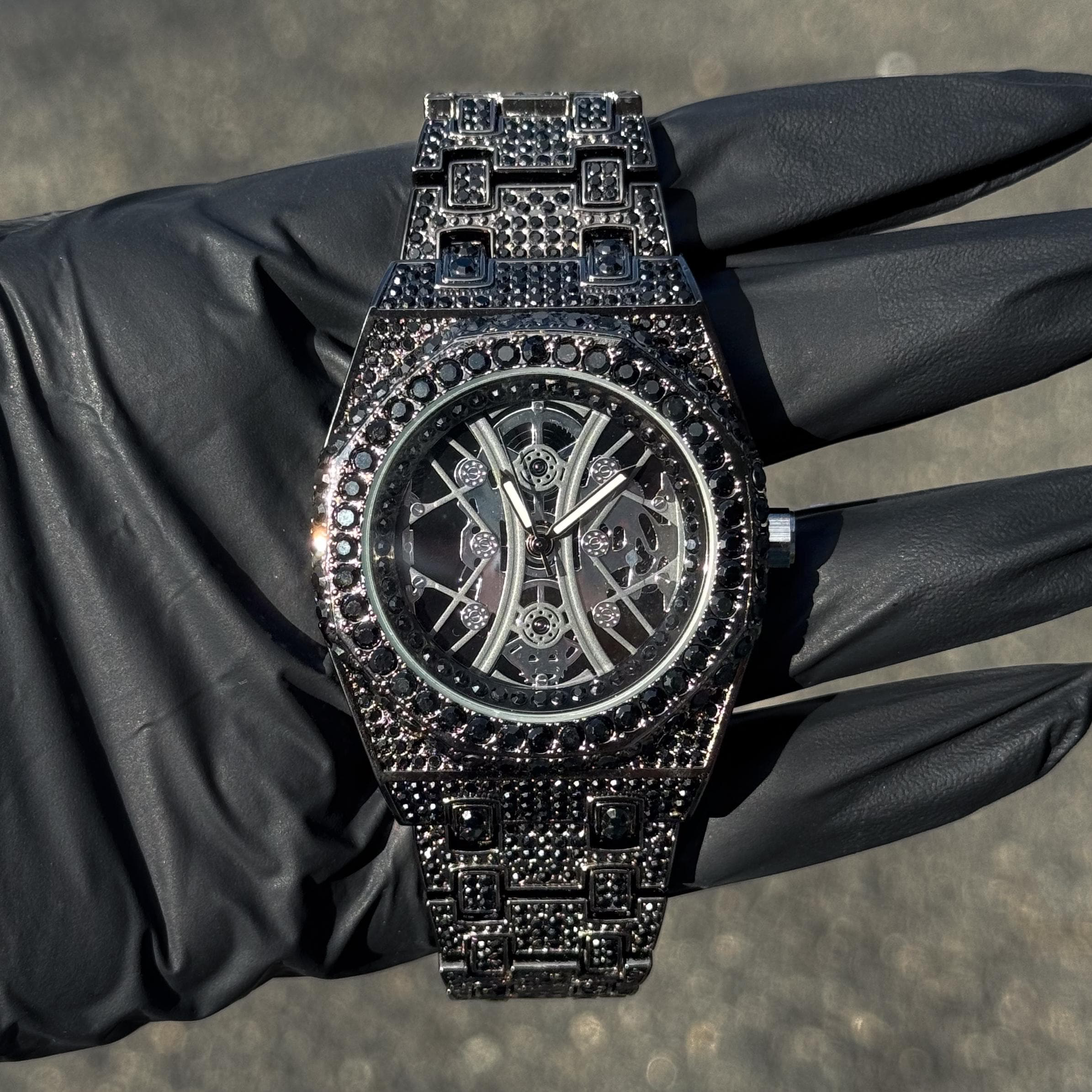 Black 43mm men’s iced out luxury watch with full black diamonds, octagon bezel and skeleton dial.
