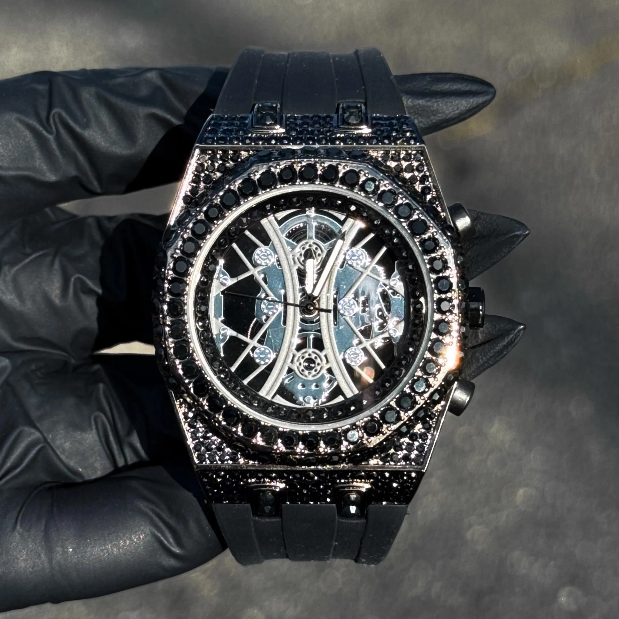 Black iced Men’s 43mm octagon bezel diamond watch with open skeleton dial design.