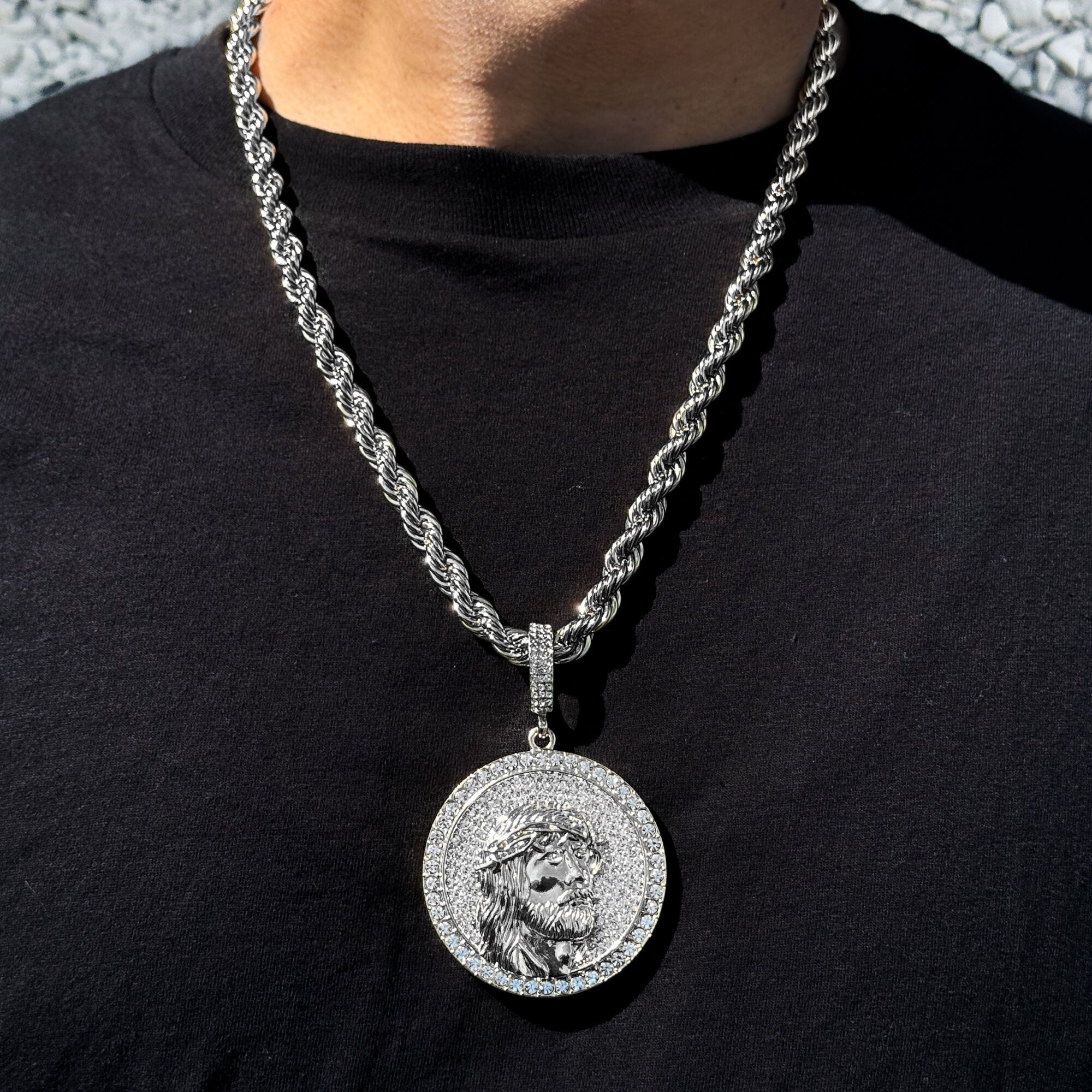 Men’s large iced-out Jesus medallion pendant in silver on an 8mm rope chain with detailed shine.
