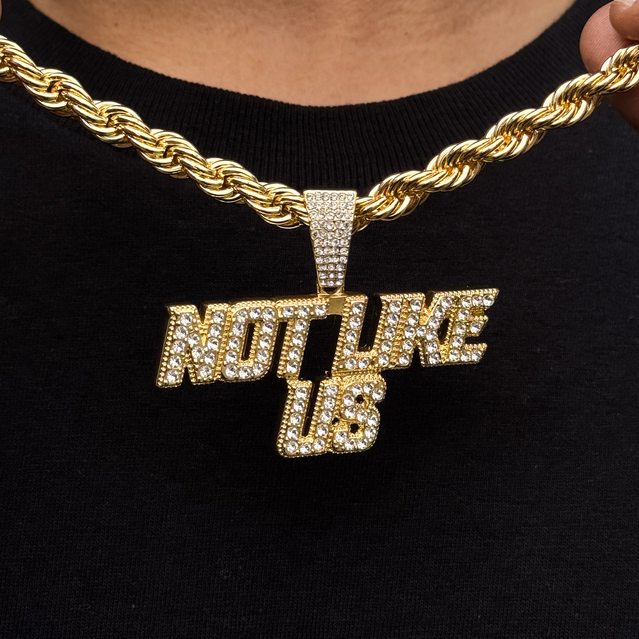 Gold iced-out “Not Like Us” pendant on thick 8mm rope chain for men, hip-hop style jewelry