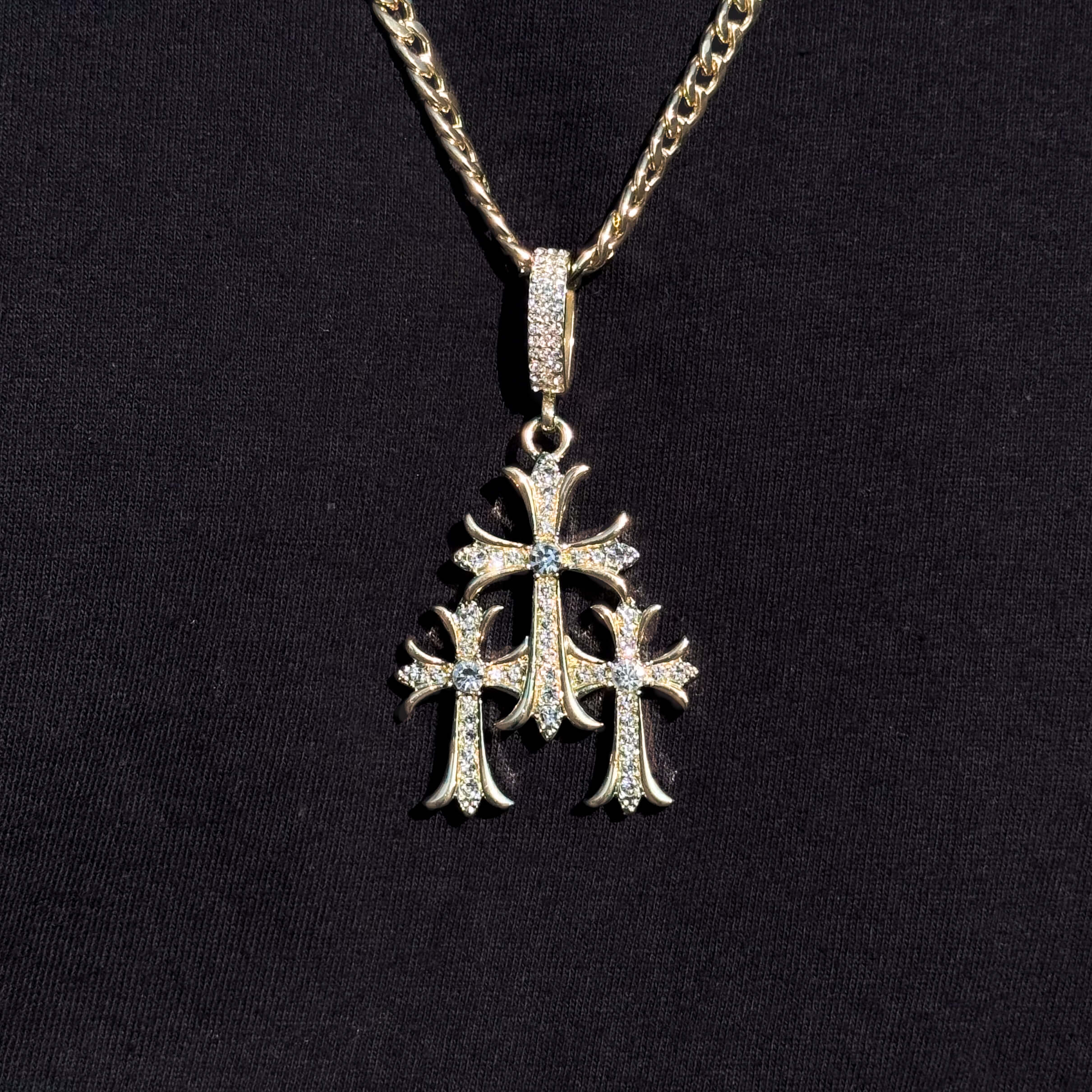 Men's iced out triple cross pendant on gold 5mm chain, detailed sparkling design for faith jewelry.