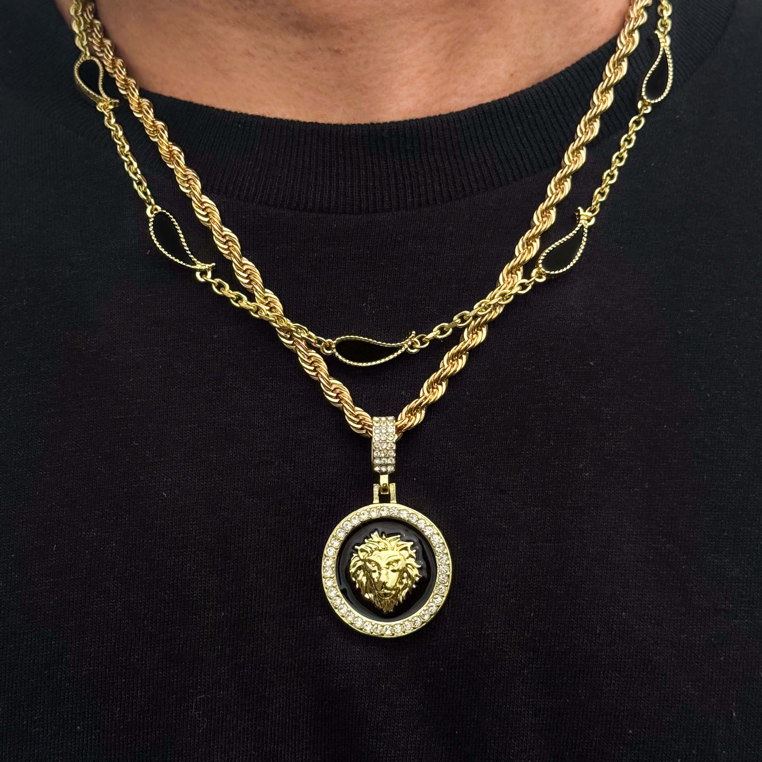 Gold lion medallion necklace with black enamel center and cubic zirconia border, part of 2-piece set