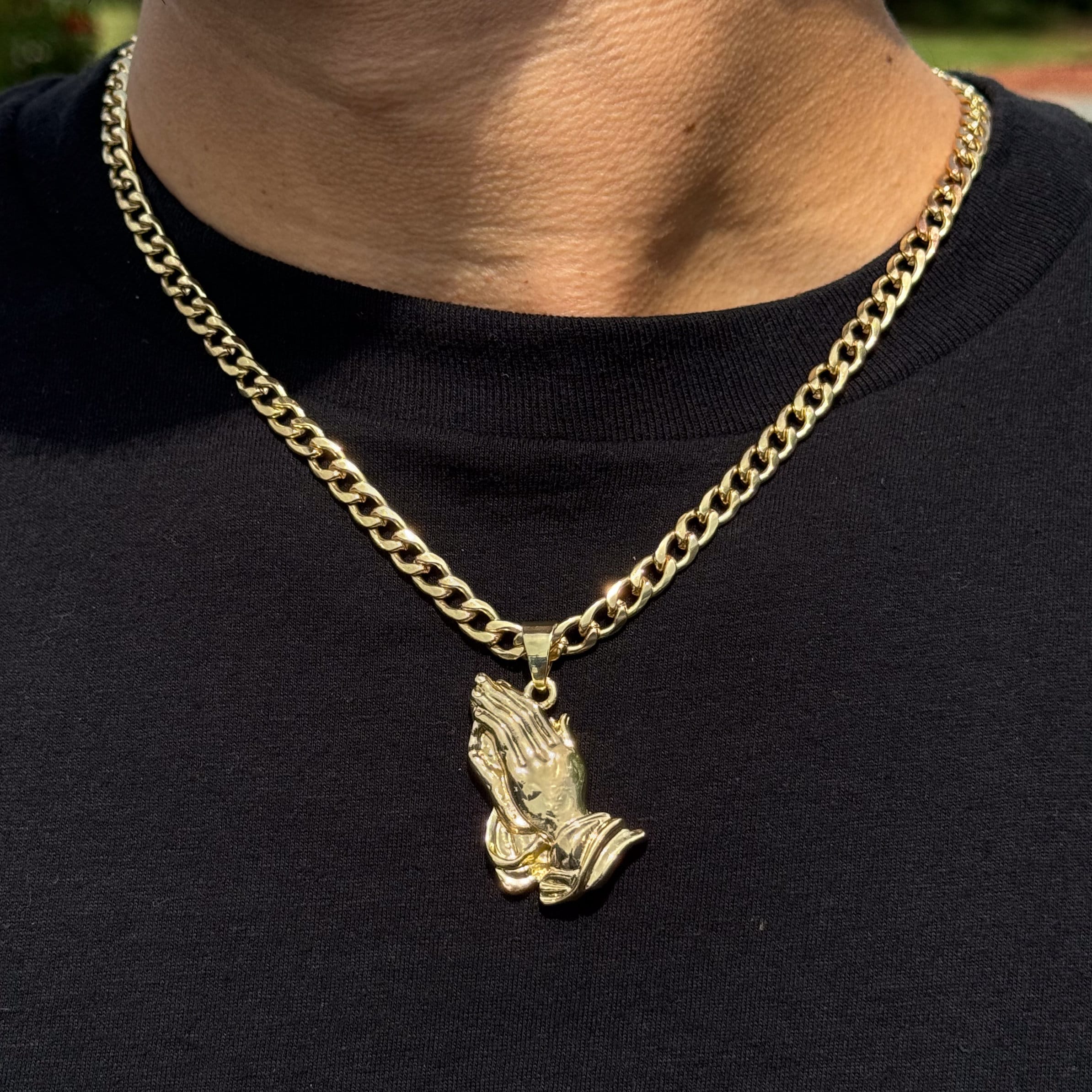 Men’s medium gold praying hands pendant on a 5mm Cuban chain with polished religious design