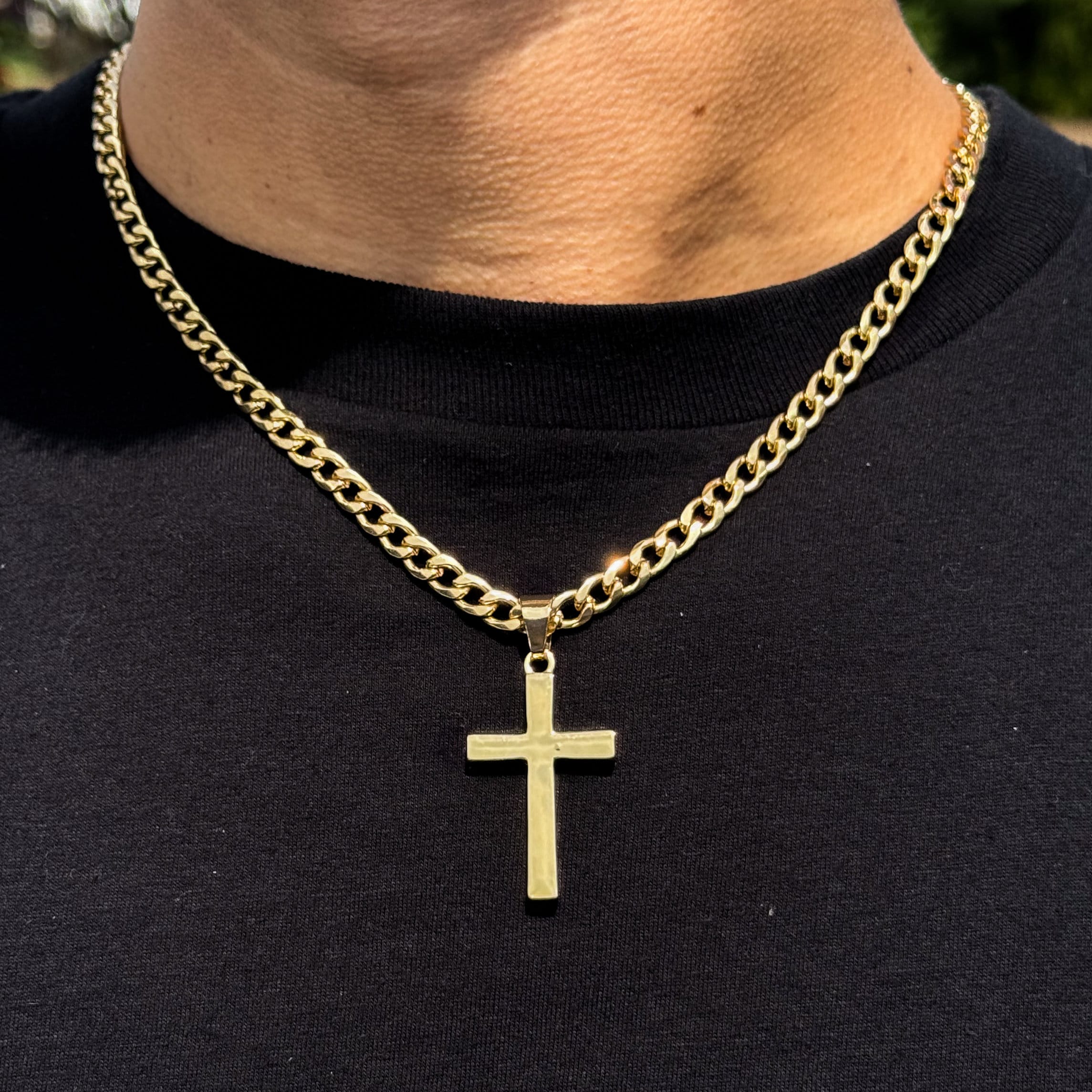 Men's medium gold solid cross pendant on 5mm Cuban chain, polished finish for a bold look.