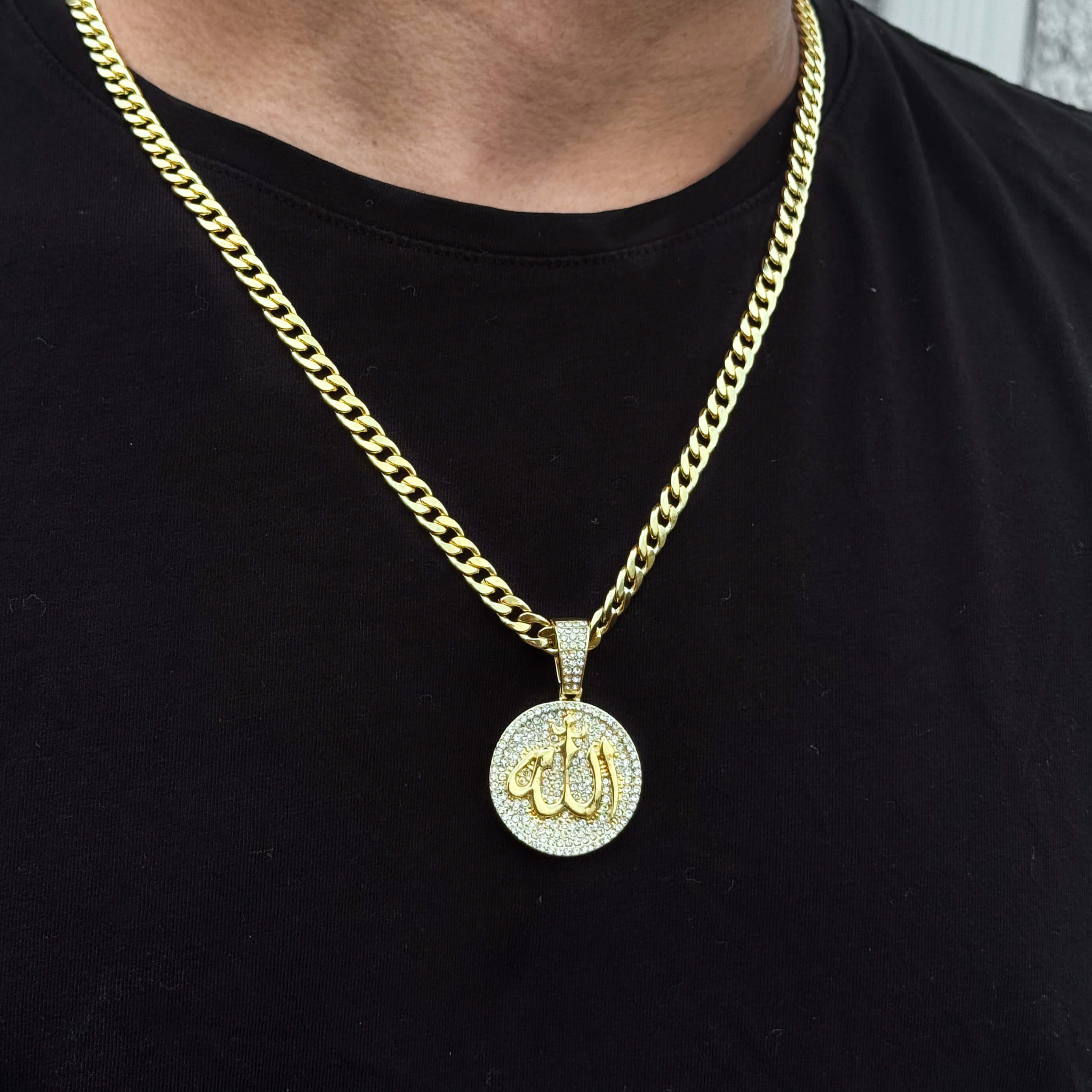 Gold Men's 22mm Iced-Out Medallion Allah Pendant with 6mm Cuban Chain on black shirt.