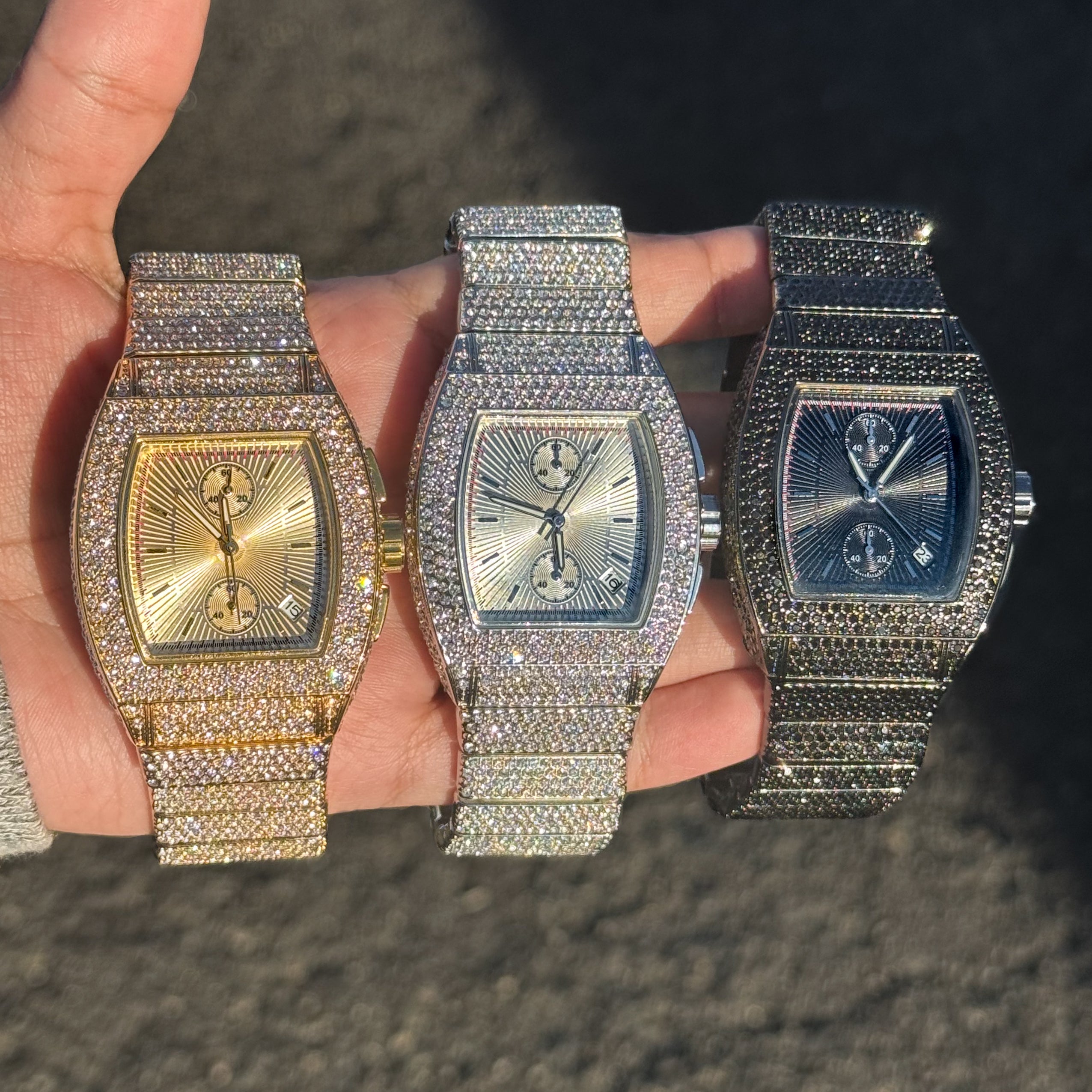 Men's 39mm iced out tonneau watches in gold, silver, and black with fully diamond-set cases.