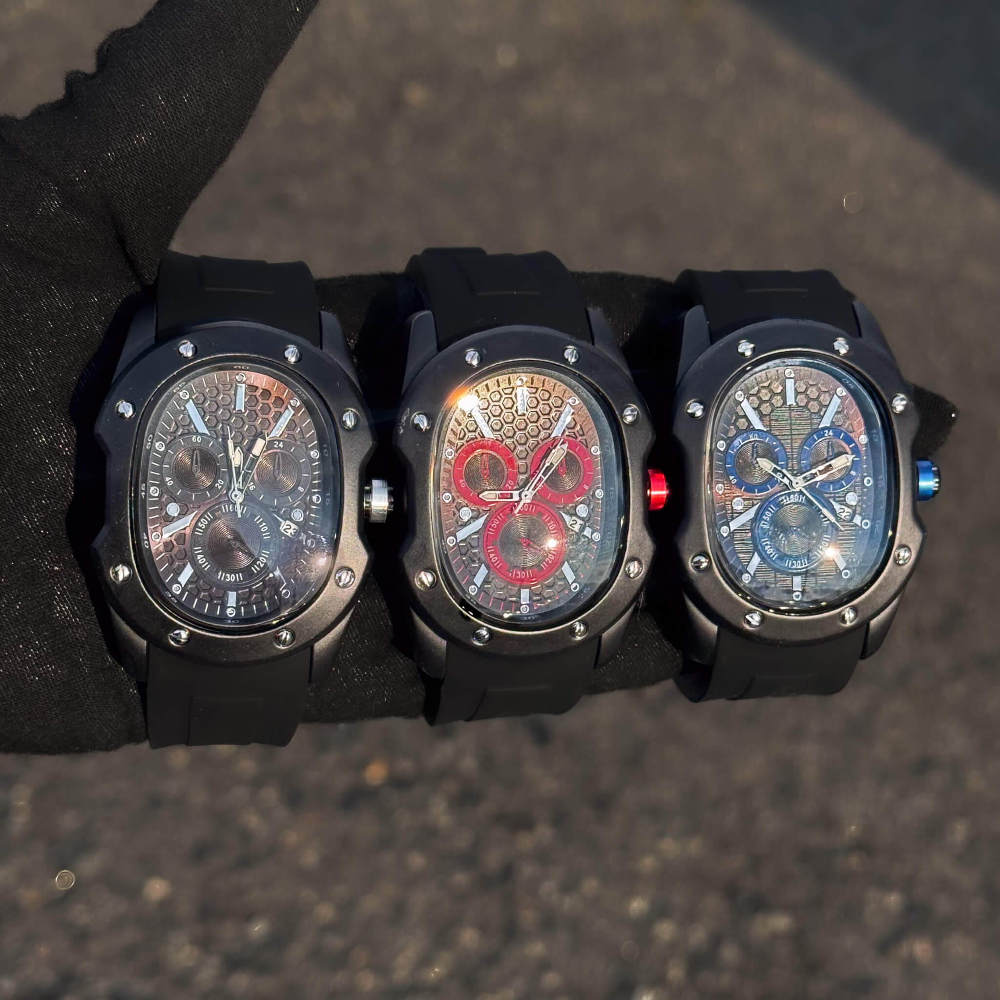 Three Men’s 40mm Classic Black Watches with honeycomb dials in black, red, and blue accents.
