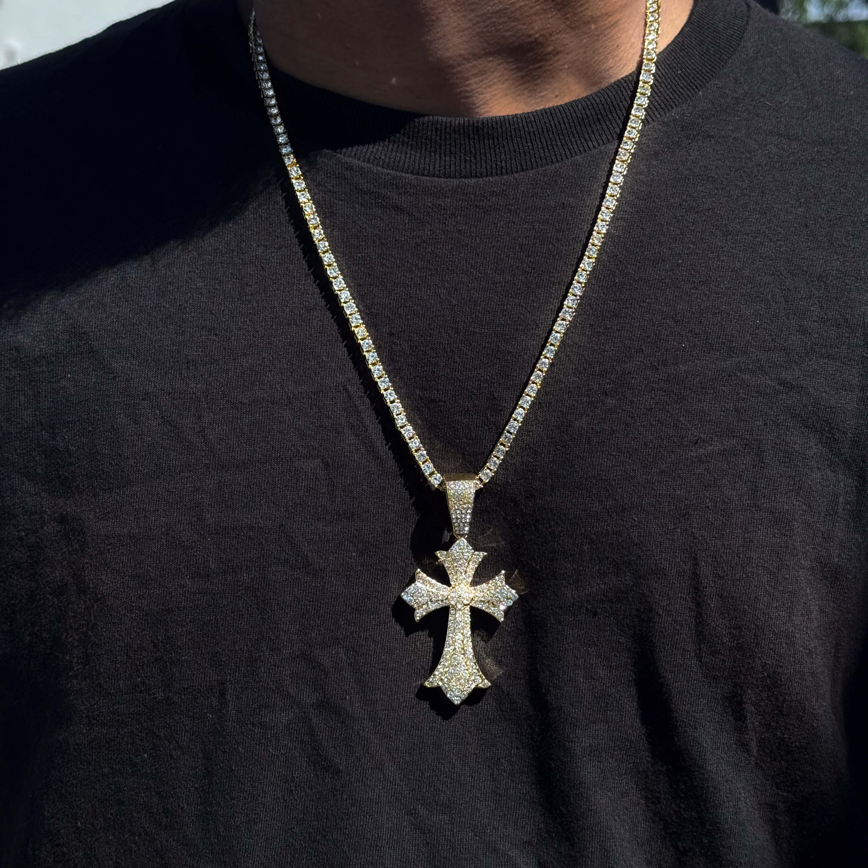 Gold men’s 40mm iced-out cross pendant on 5mm tennis chain featuring pavé clear stones.