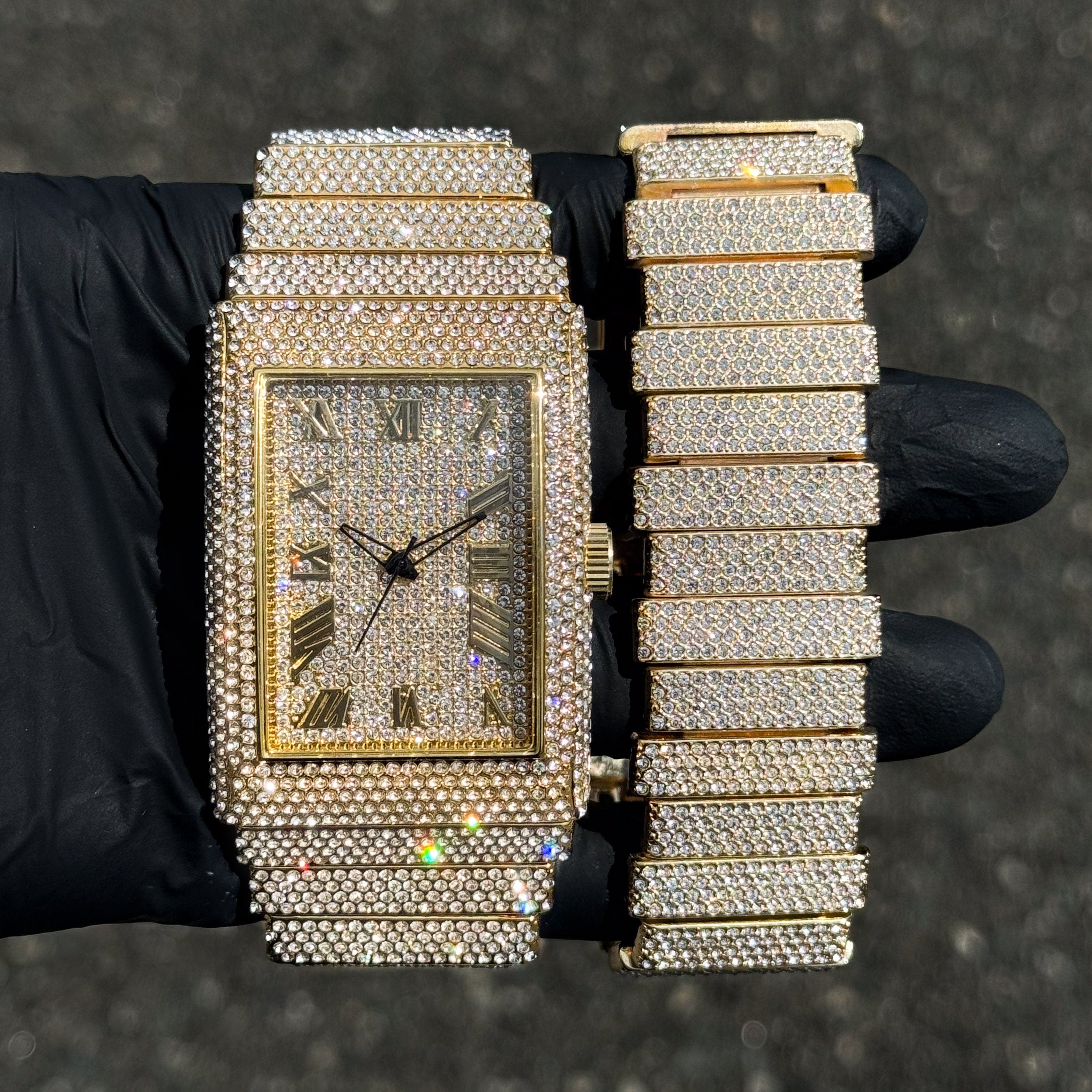 Men's 40mm gold fully iced out diamond watch with matching staggered link bracelet set.